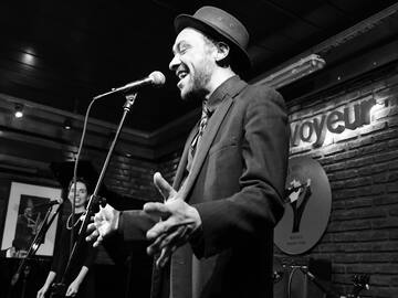 a man singing into a microphone