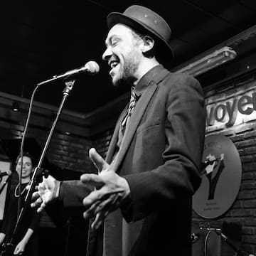 a man singing into a microphone