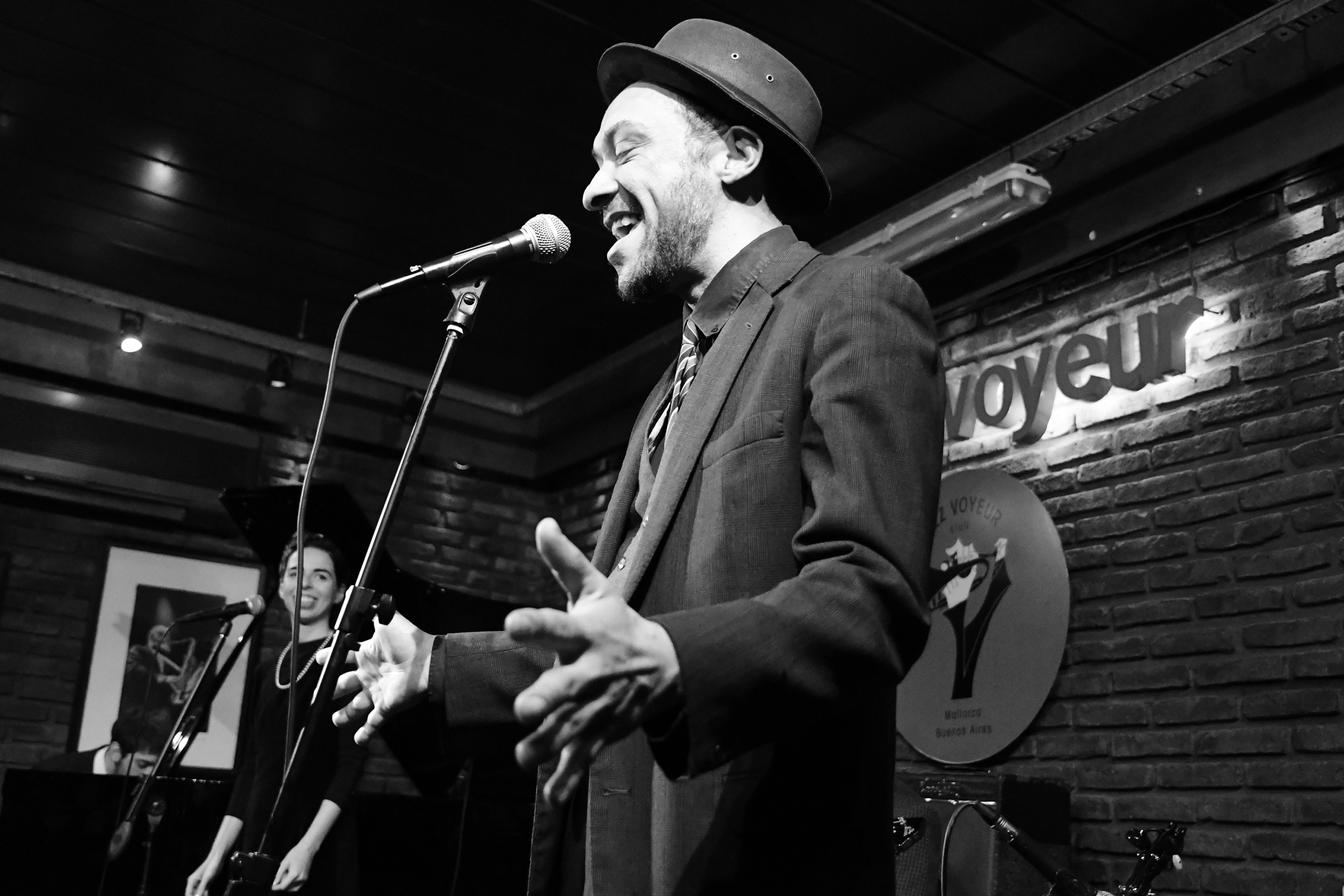 a man singing into a microphone