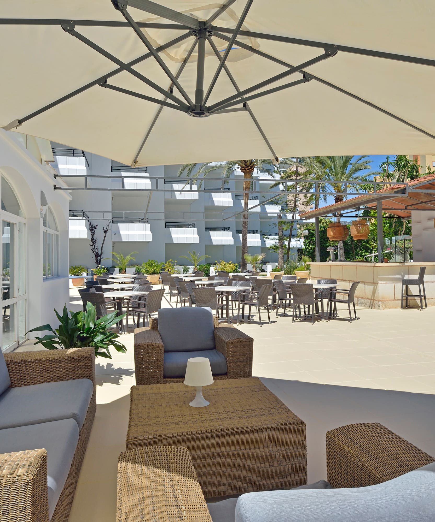 a patio area with chairs and tables