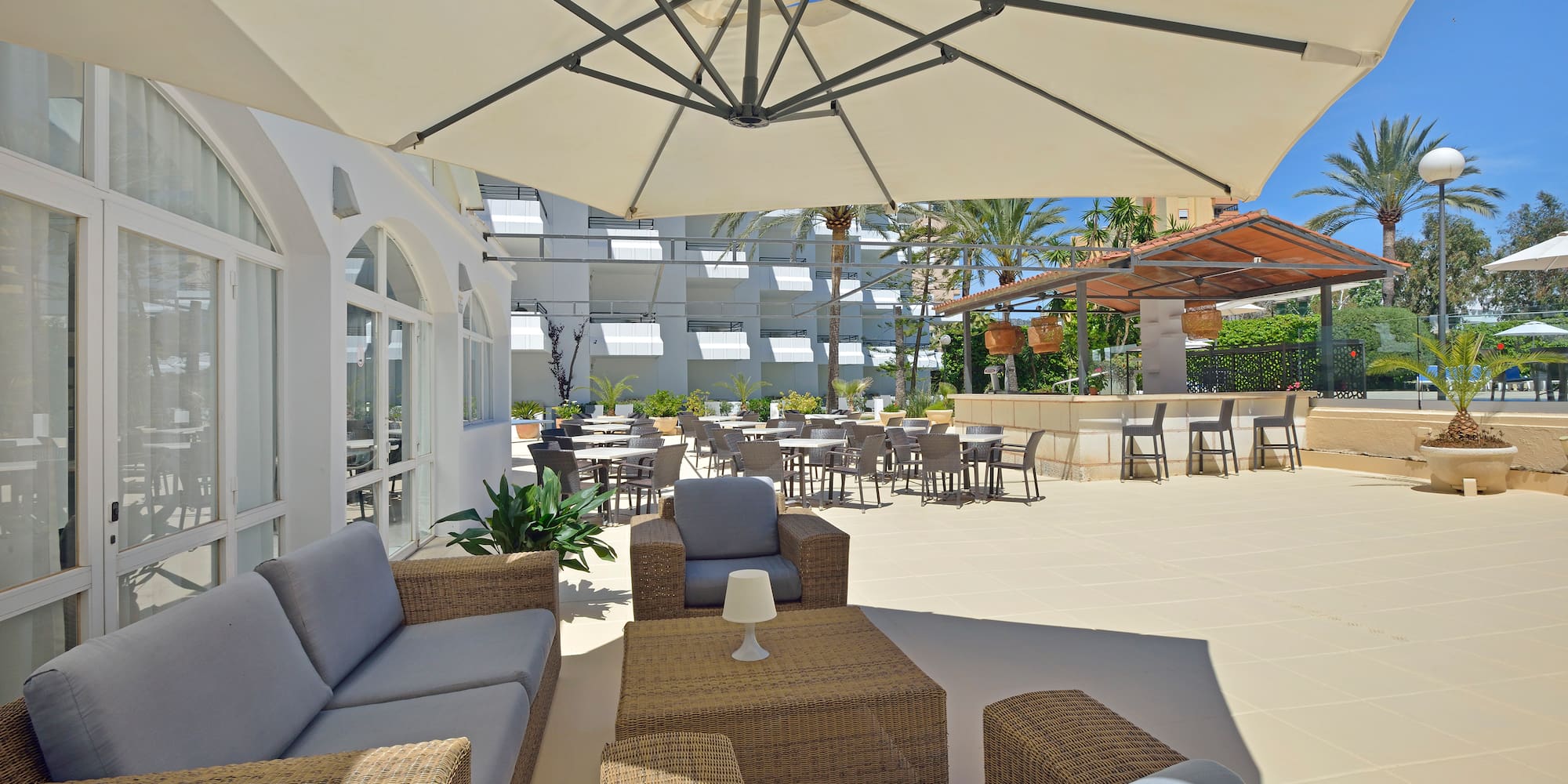 a patio area with chairs and tables