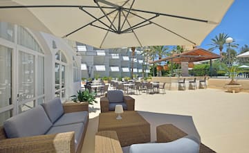 a patio area with chairs and tables