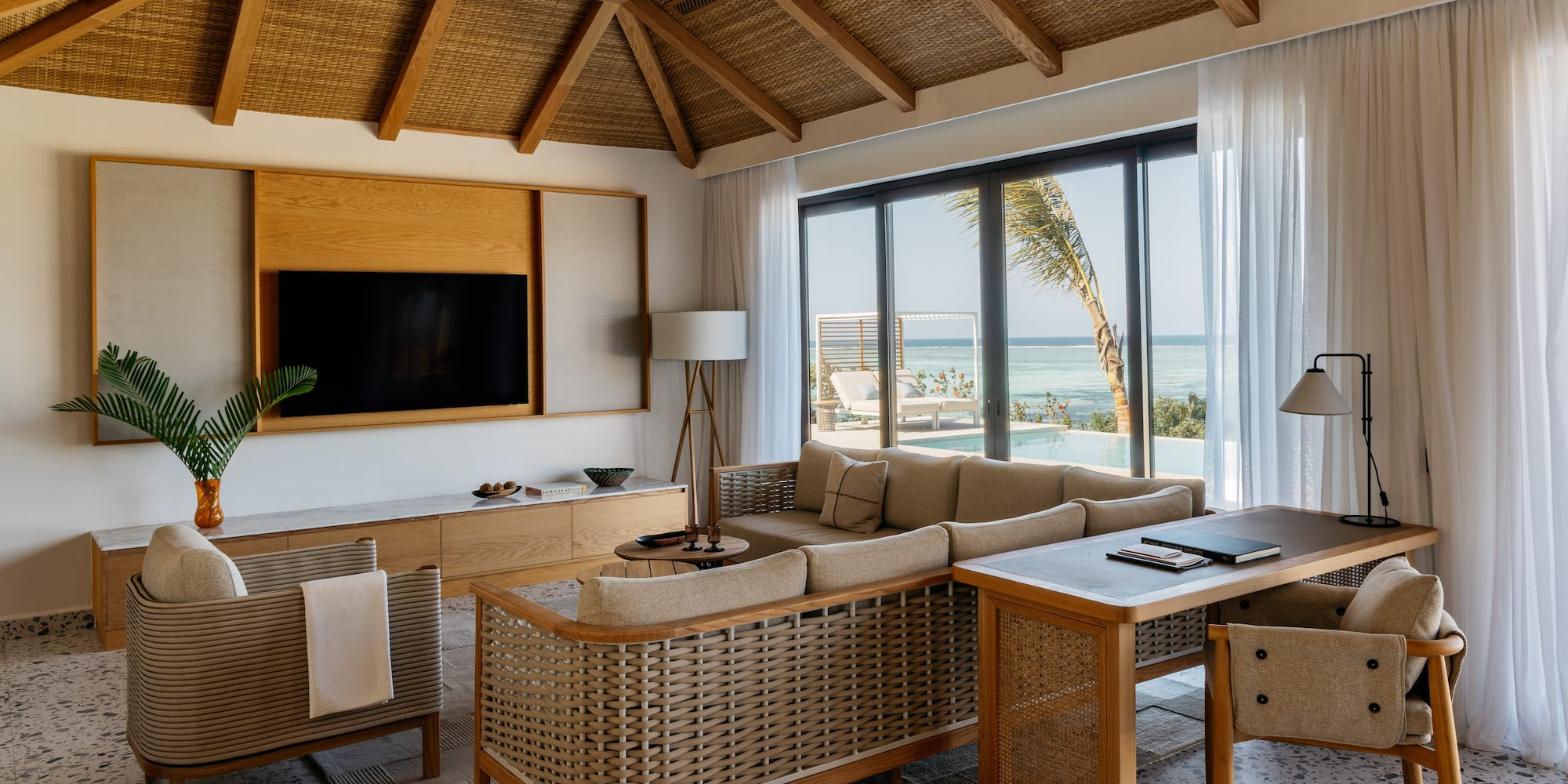 a living room with a television and a couch