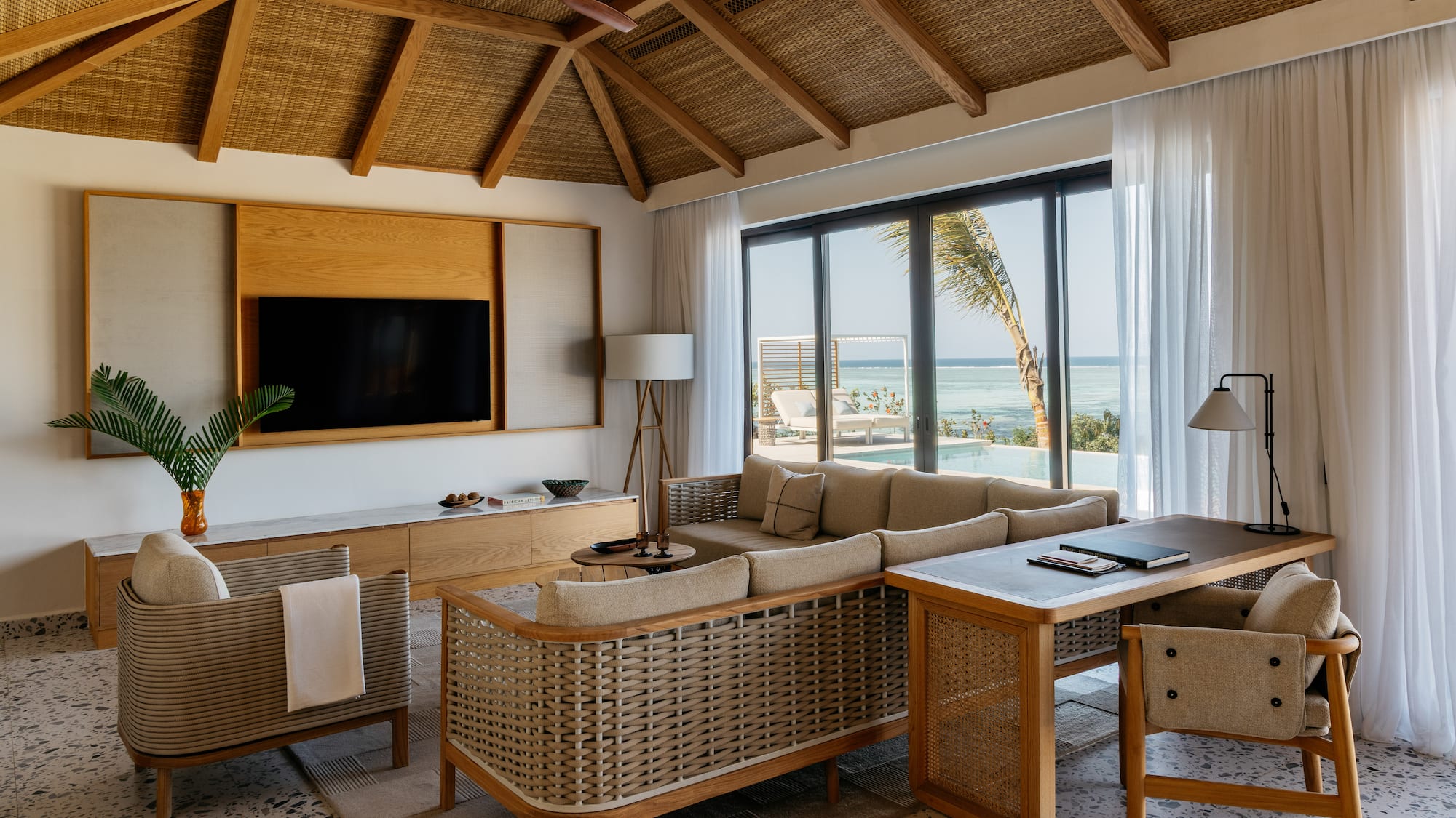 a living room with a television and a couch