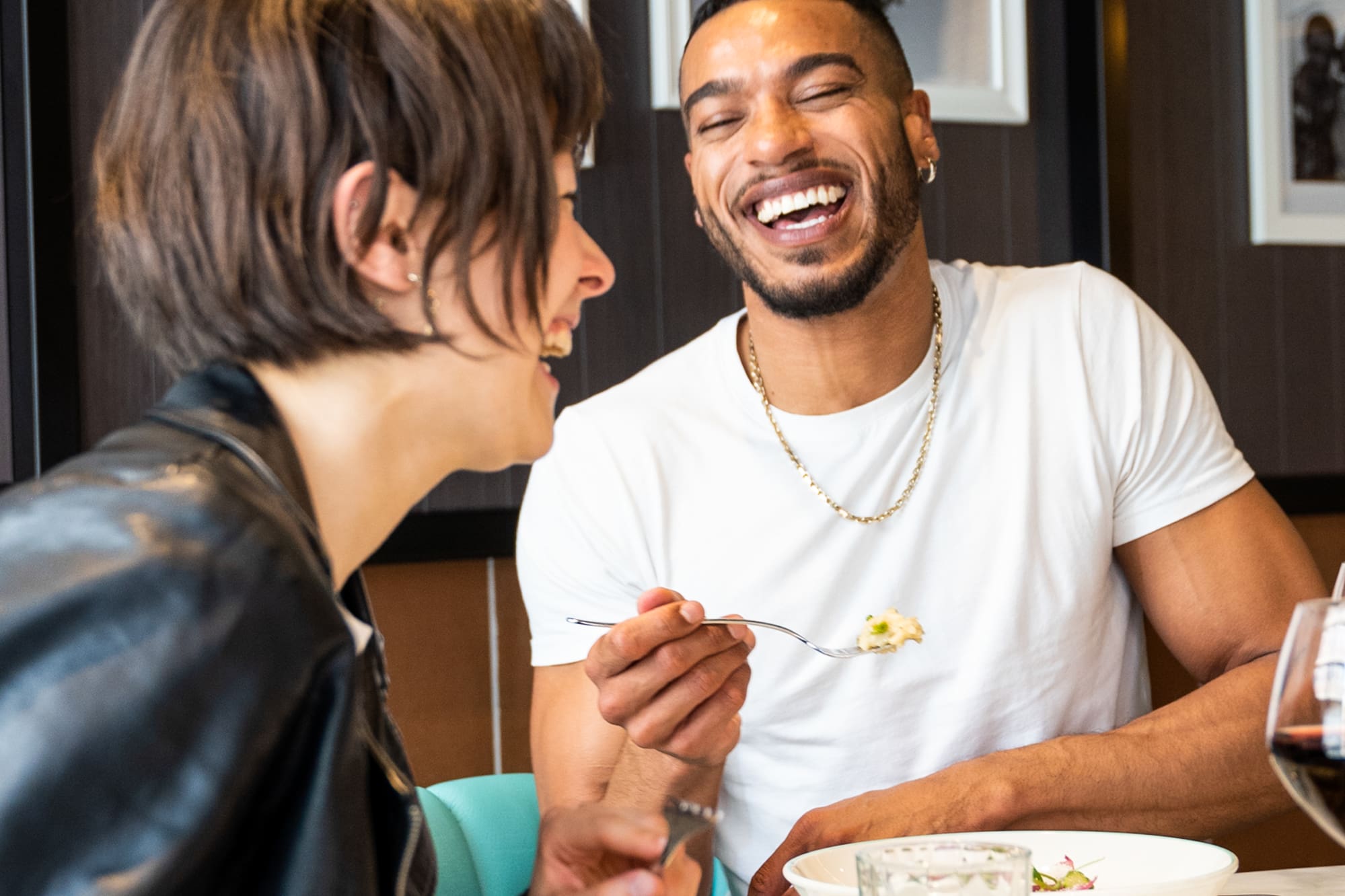 a man and woman laughing at each other
