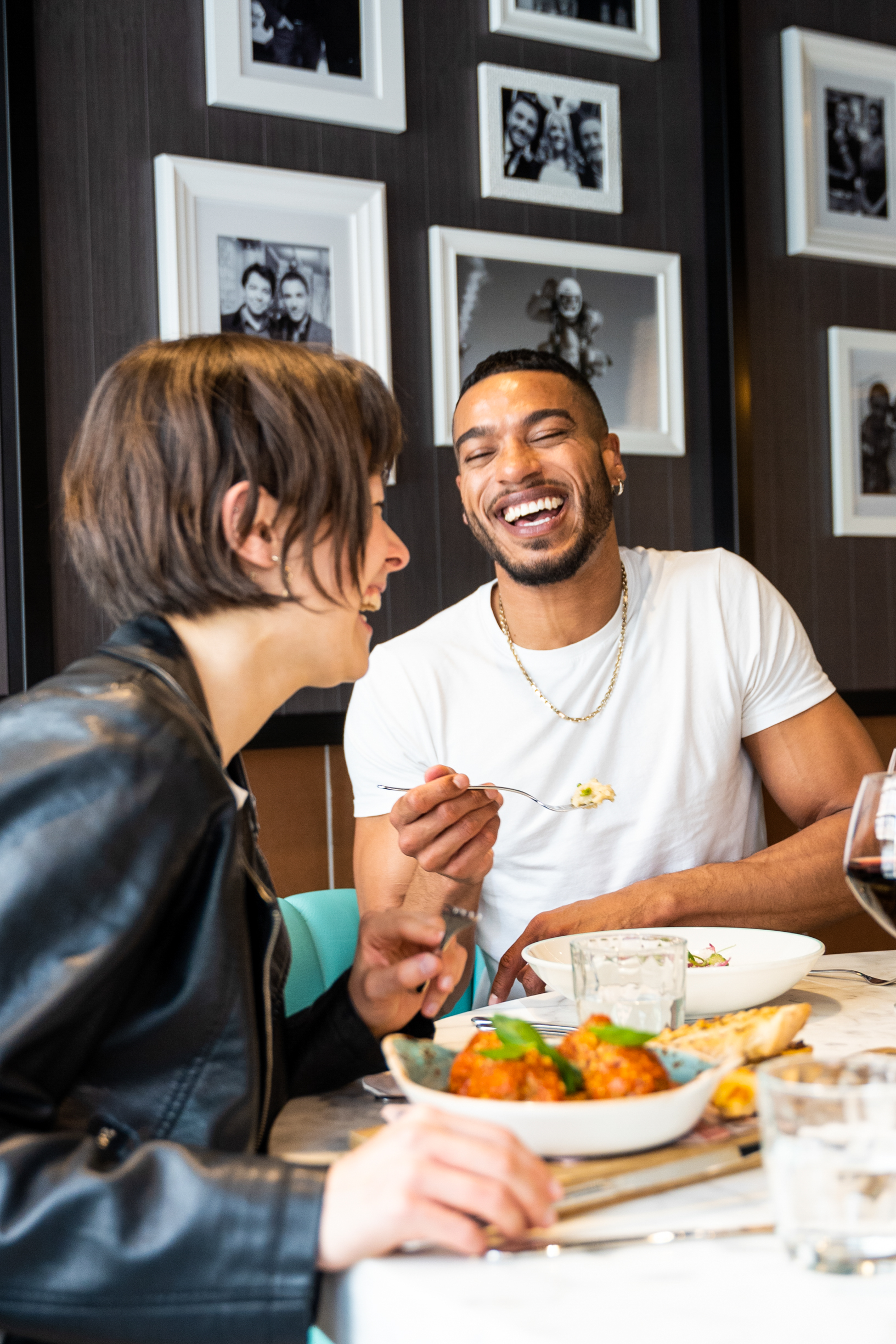 a man and woman laughing at each other