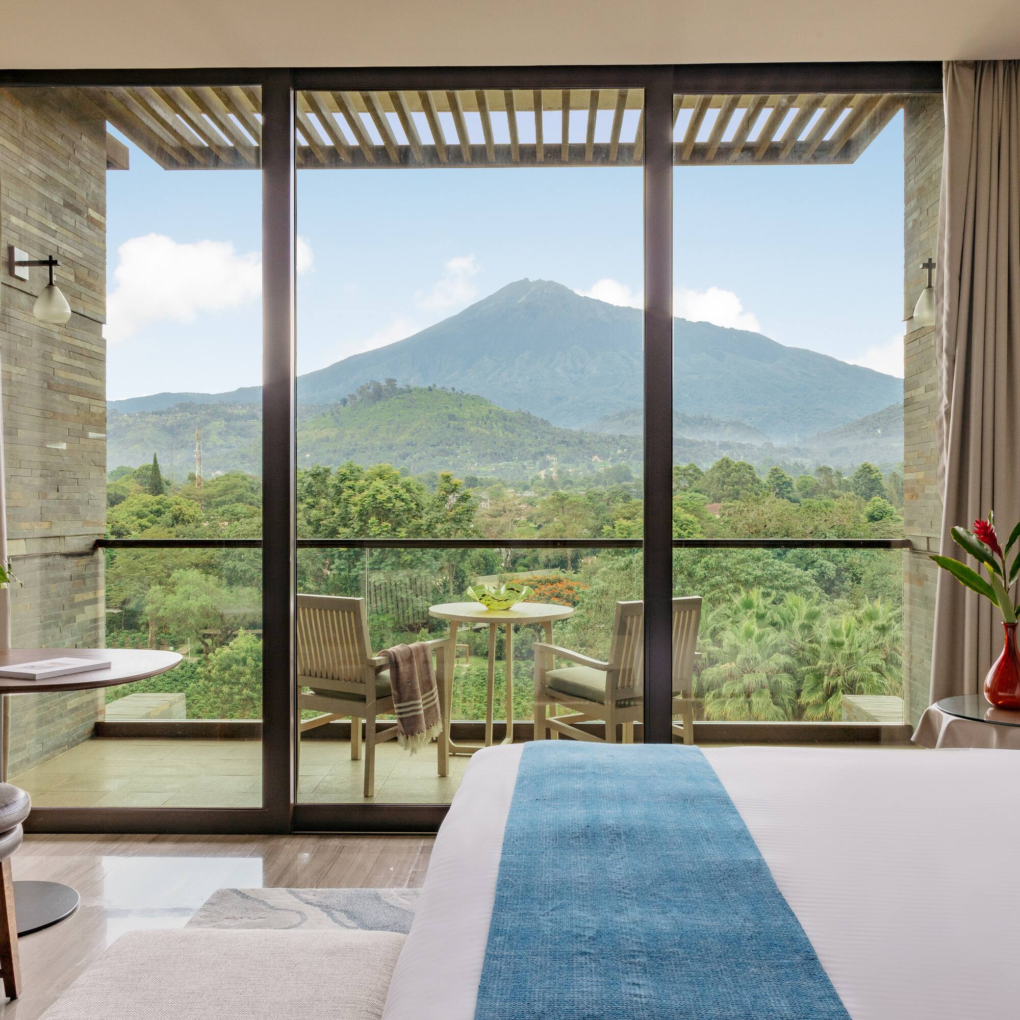 a room with a view of a mountain and trees