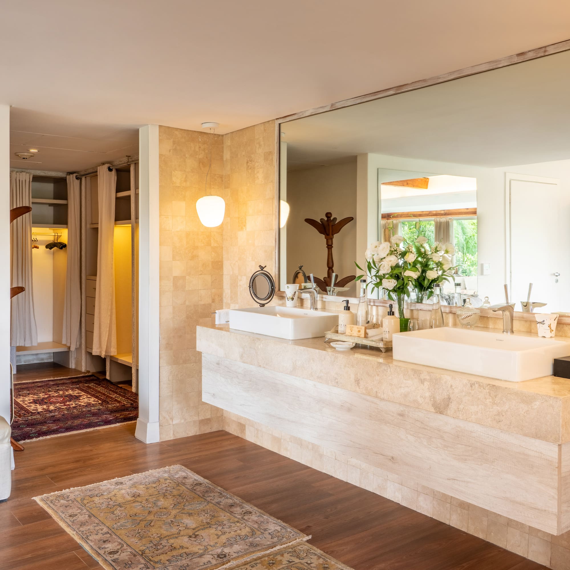 a bathroom with a large mirror and a large sink