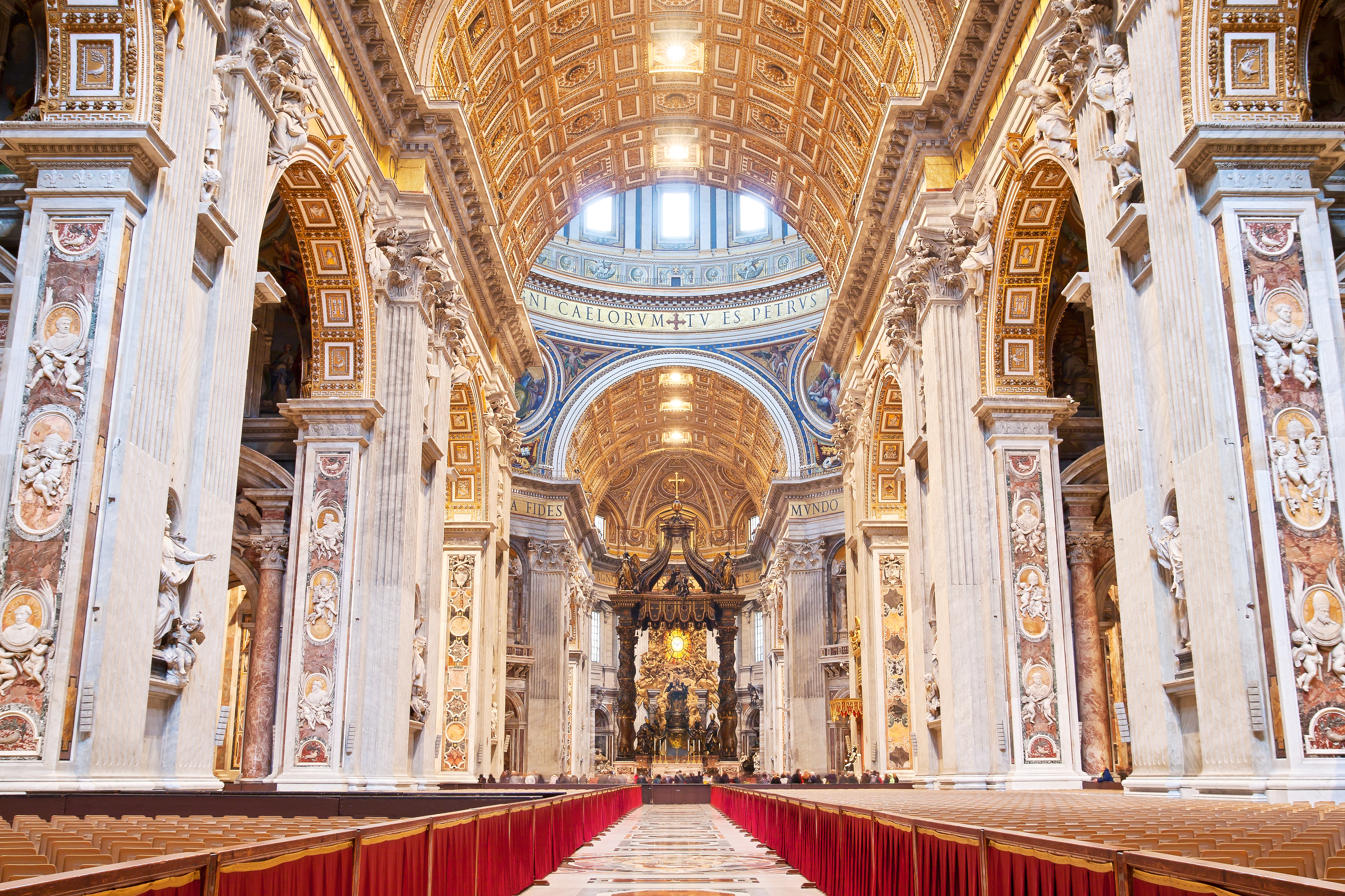a large ornate building with columns and a red cloth