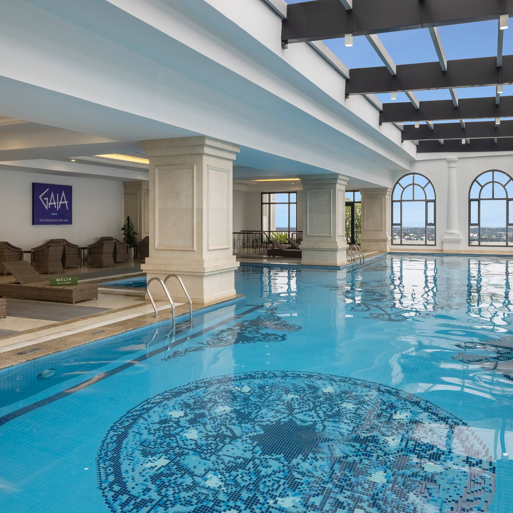 a indoor swimming pool with a large roof