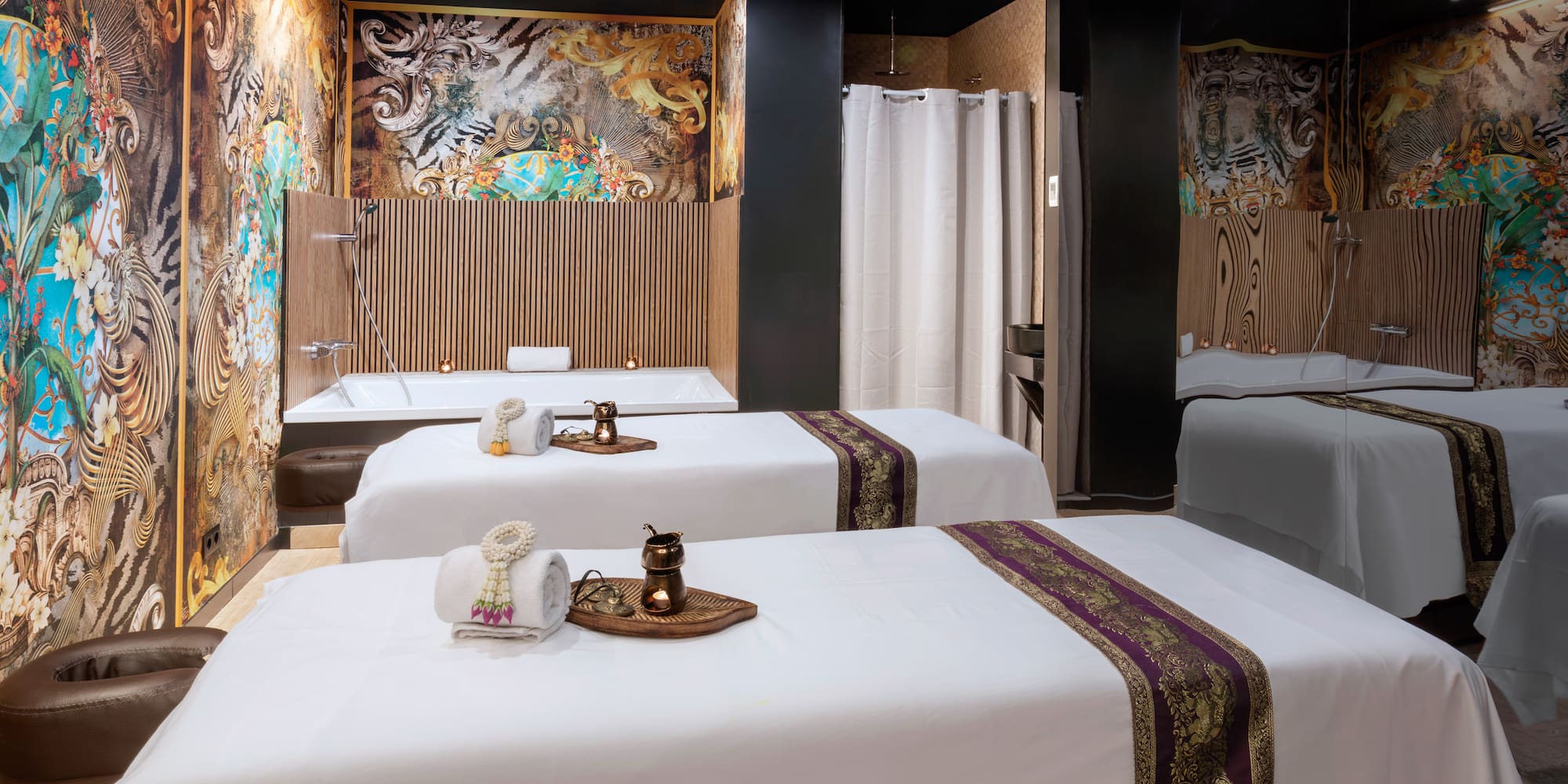 a room with beds and shower