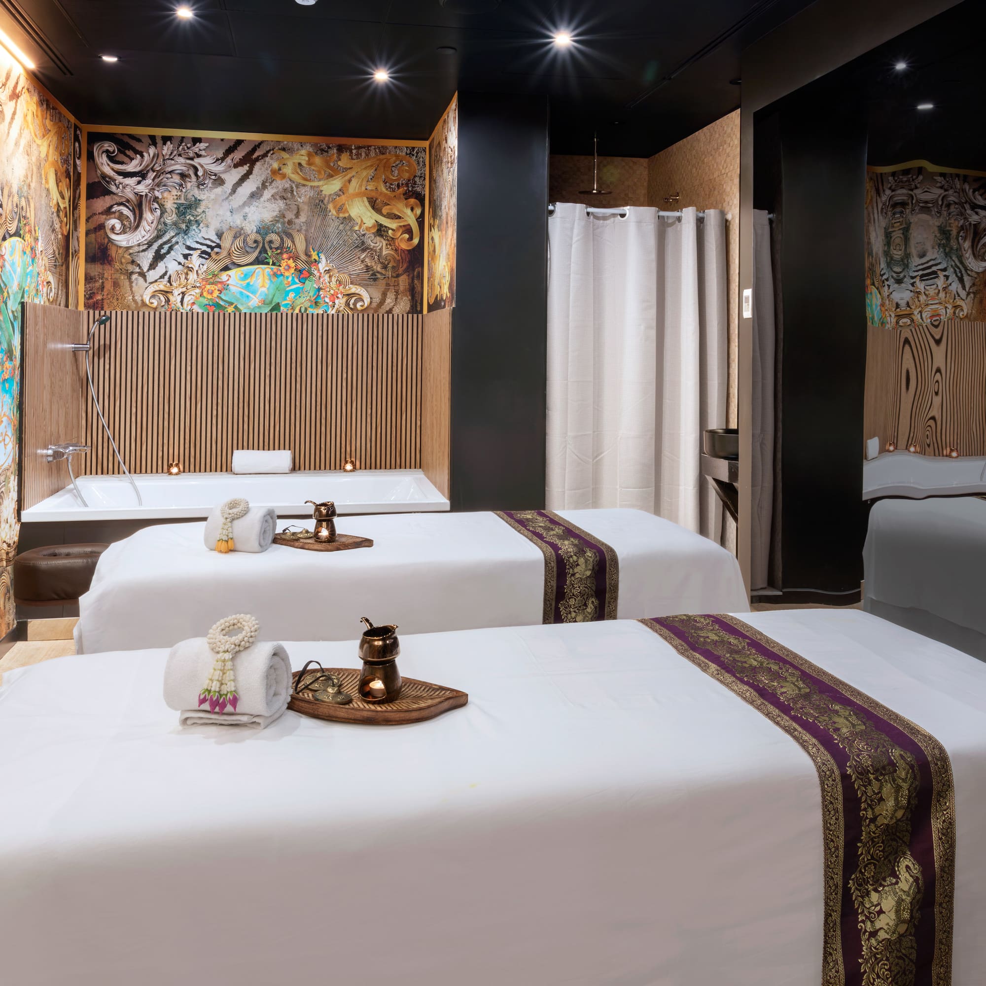 a room with beds and shower