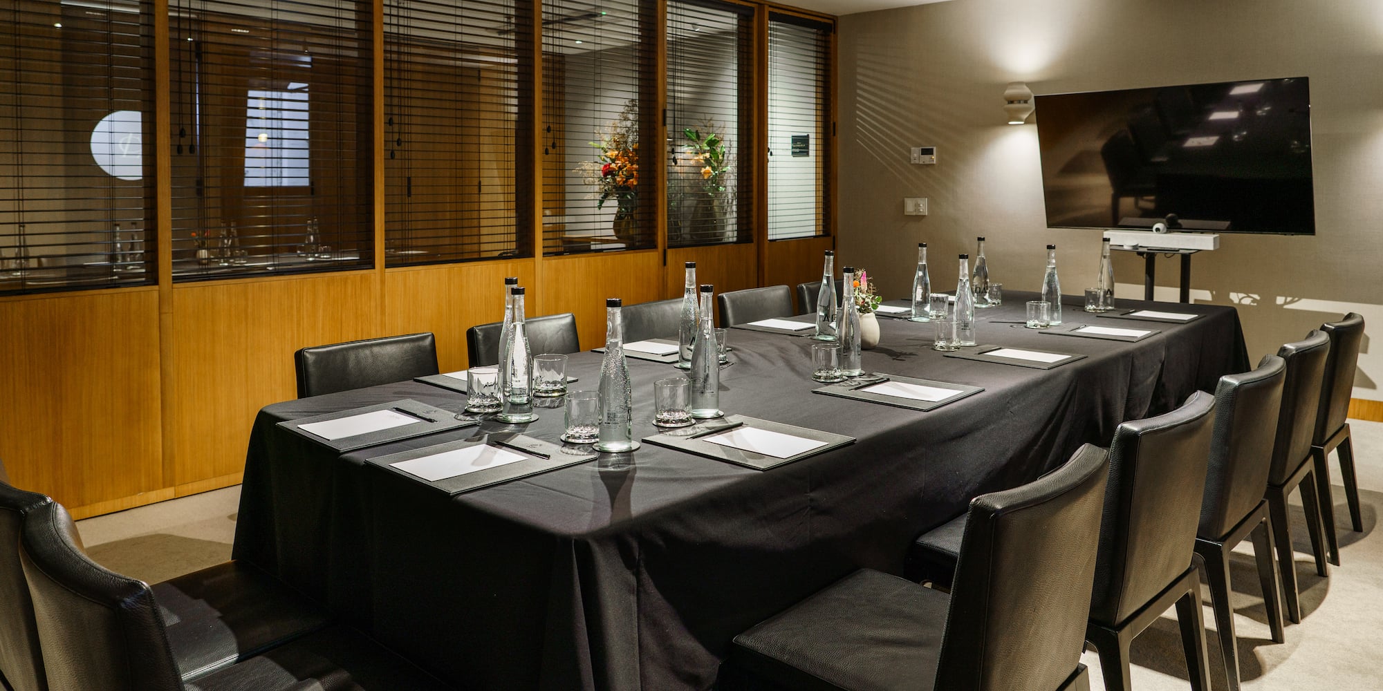 a table with black tablecloth and bottles on it