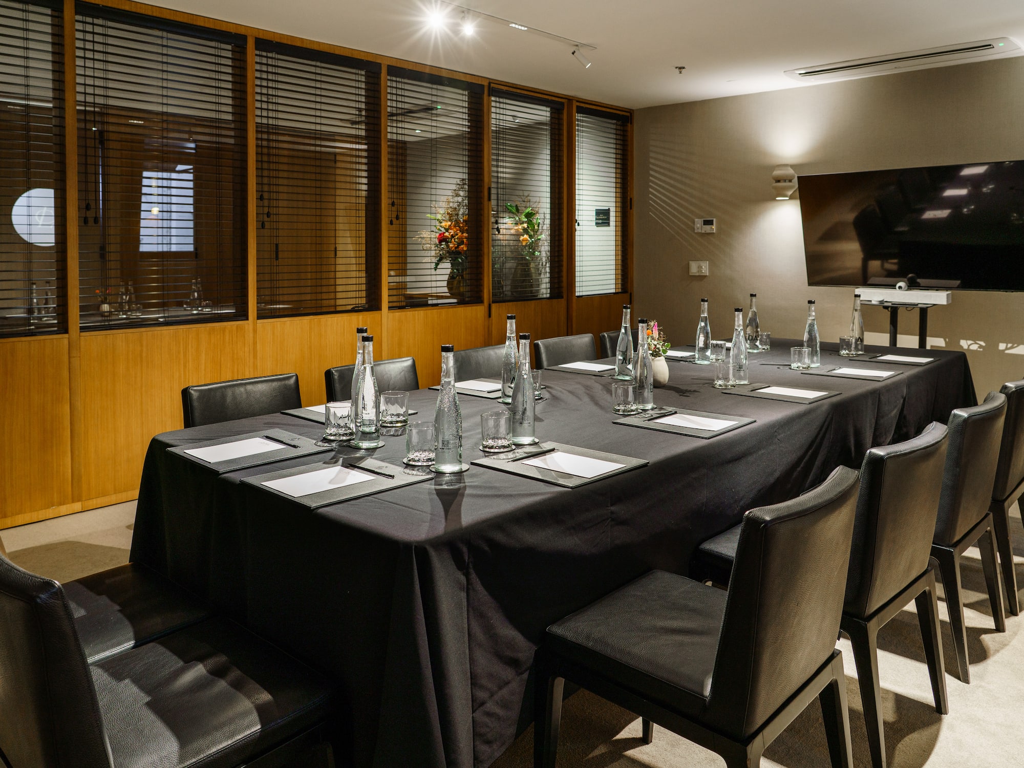 a table with black tablecloth and bottles on it