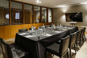 a table with black tablecloth and bottles on it