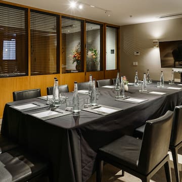 a table with black tablecloth and bottles on it