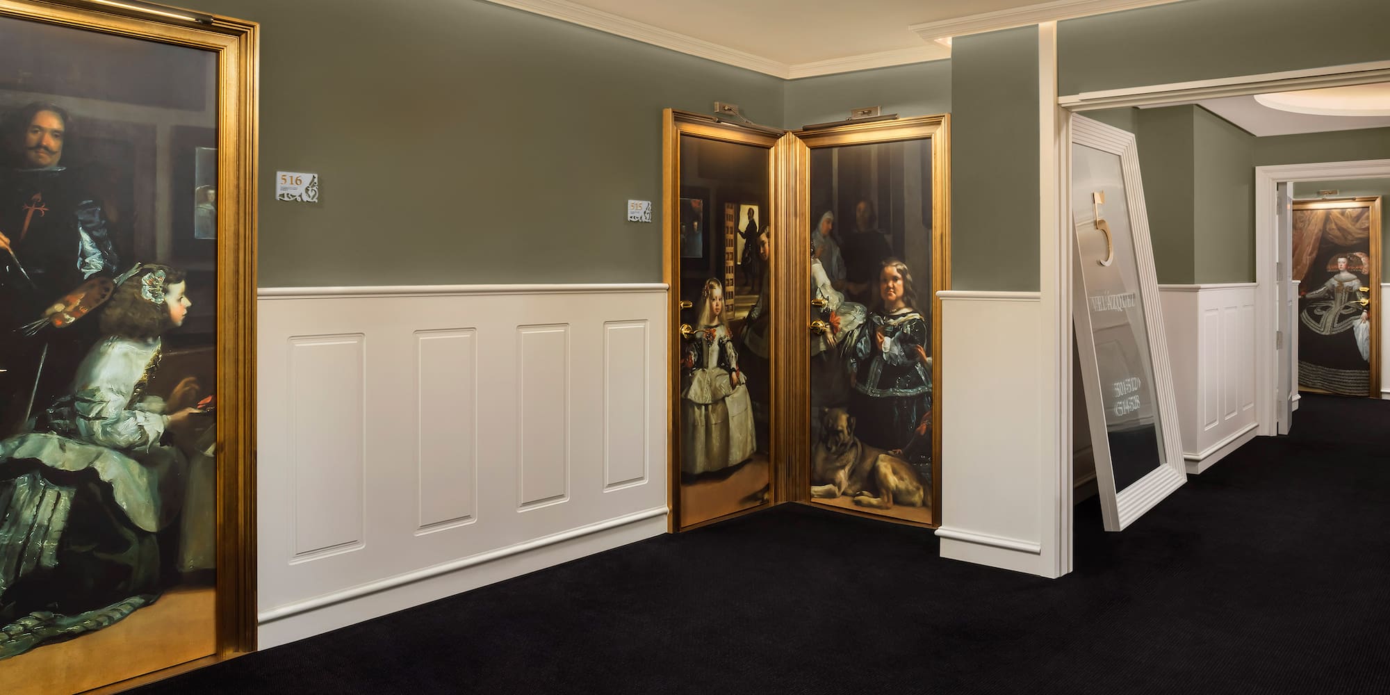 a room with a painting on the wall