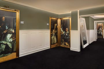 a room with a painting on the wall