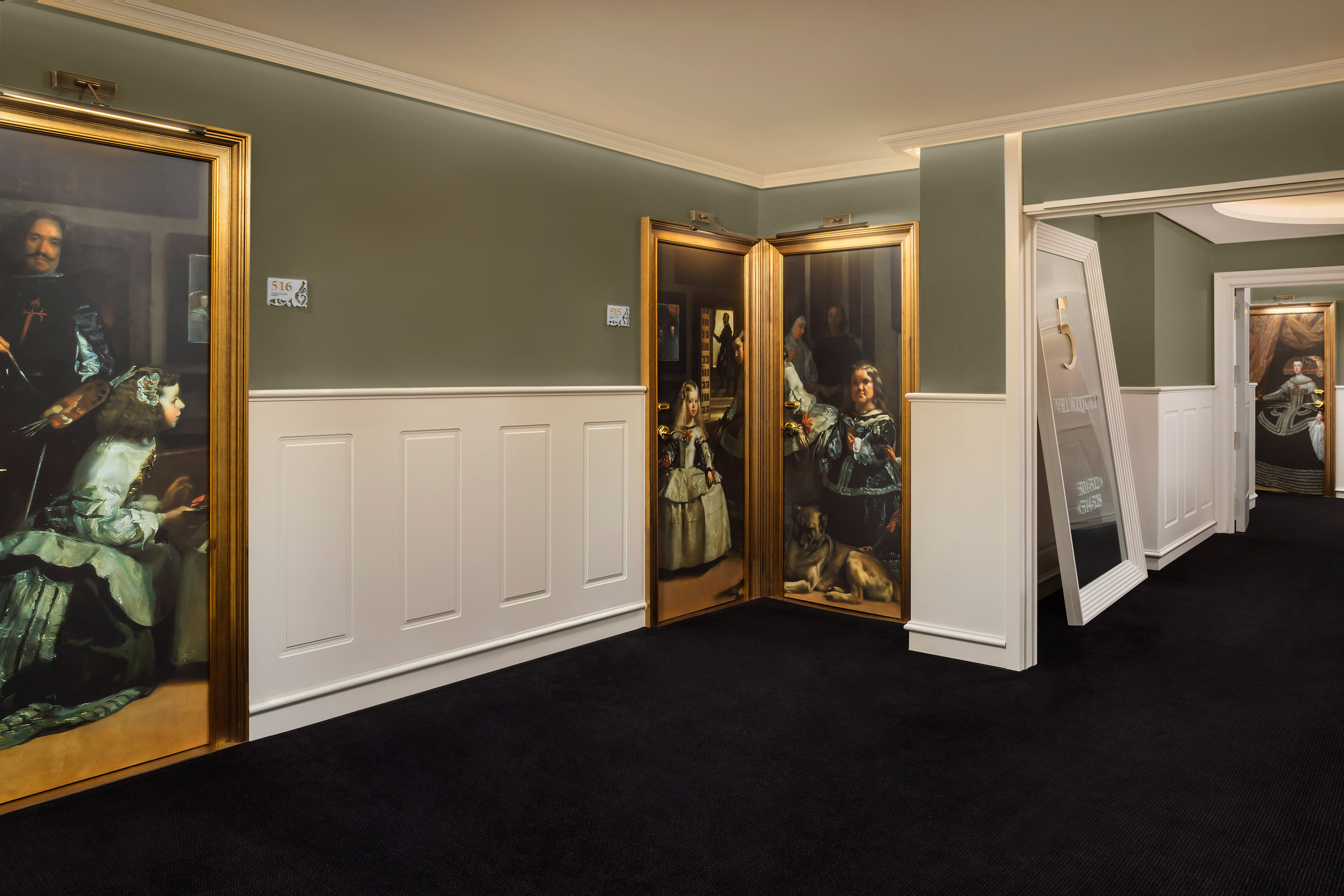 a room with a painting on the wall