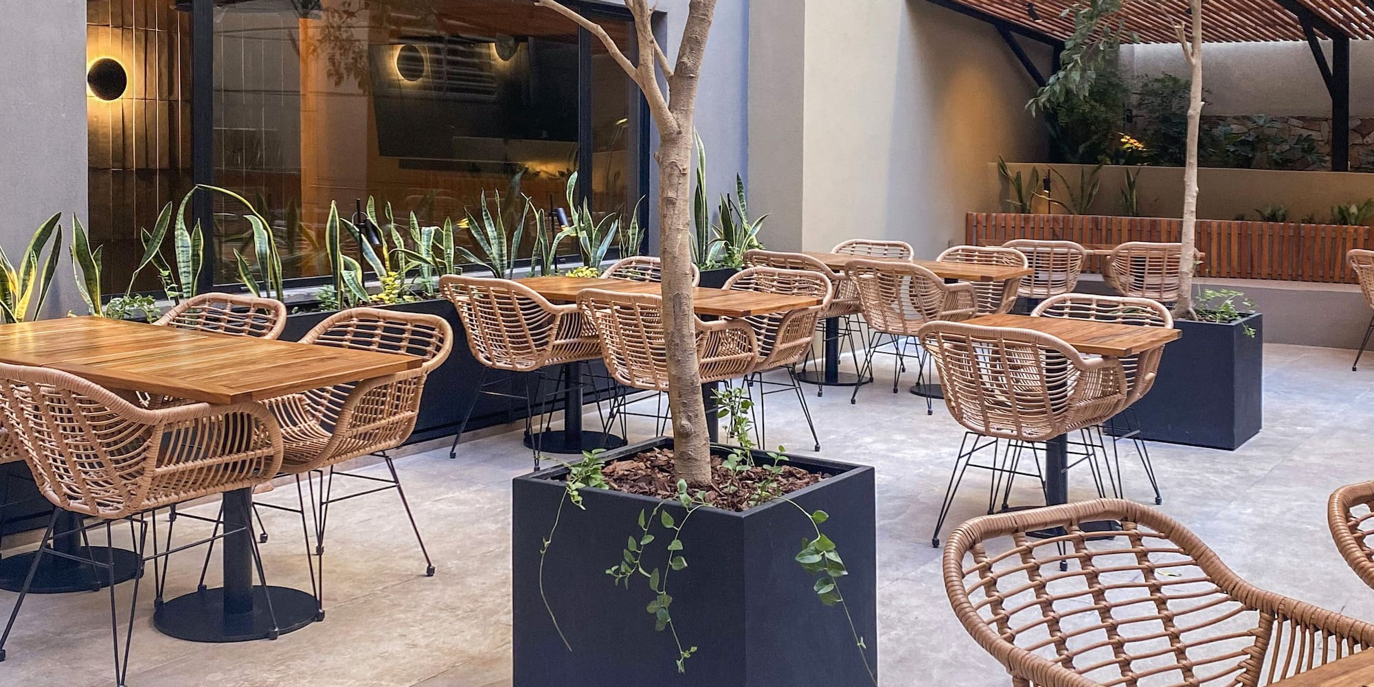 a patio with tables and chairs