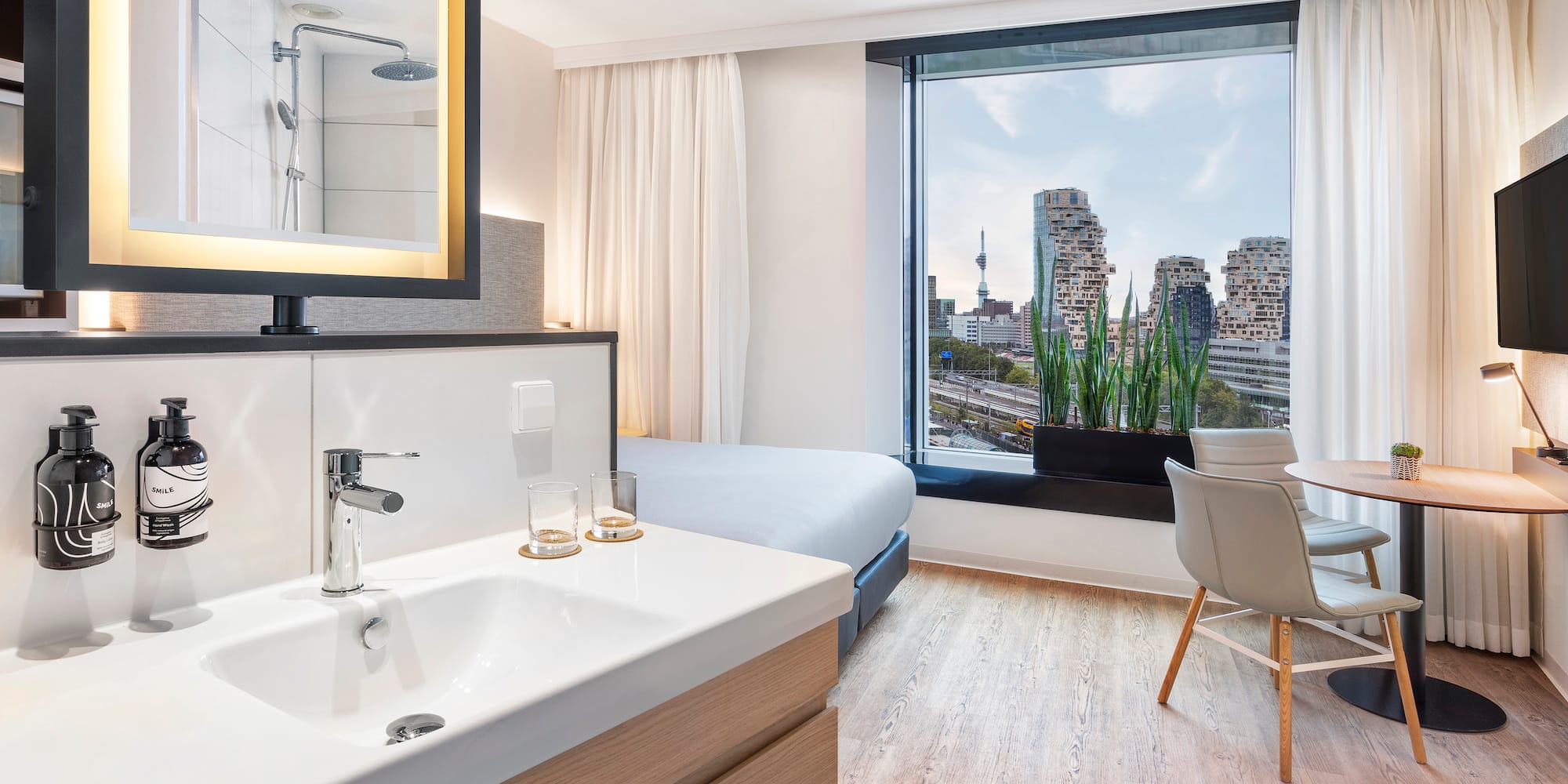 a room with a bed and a sink