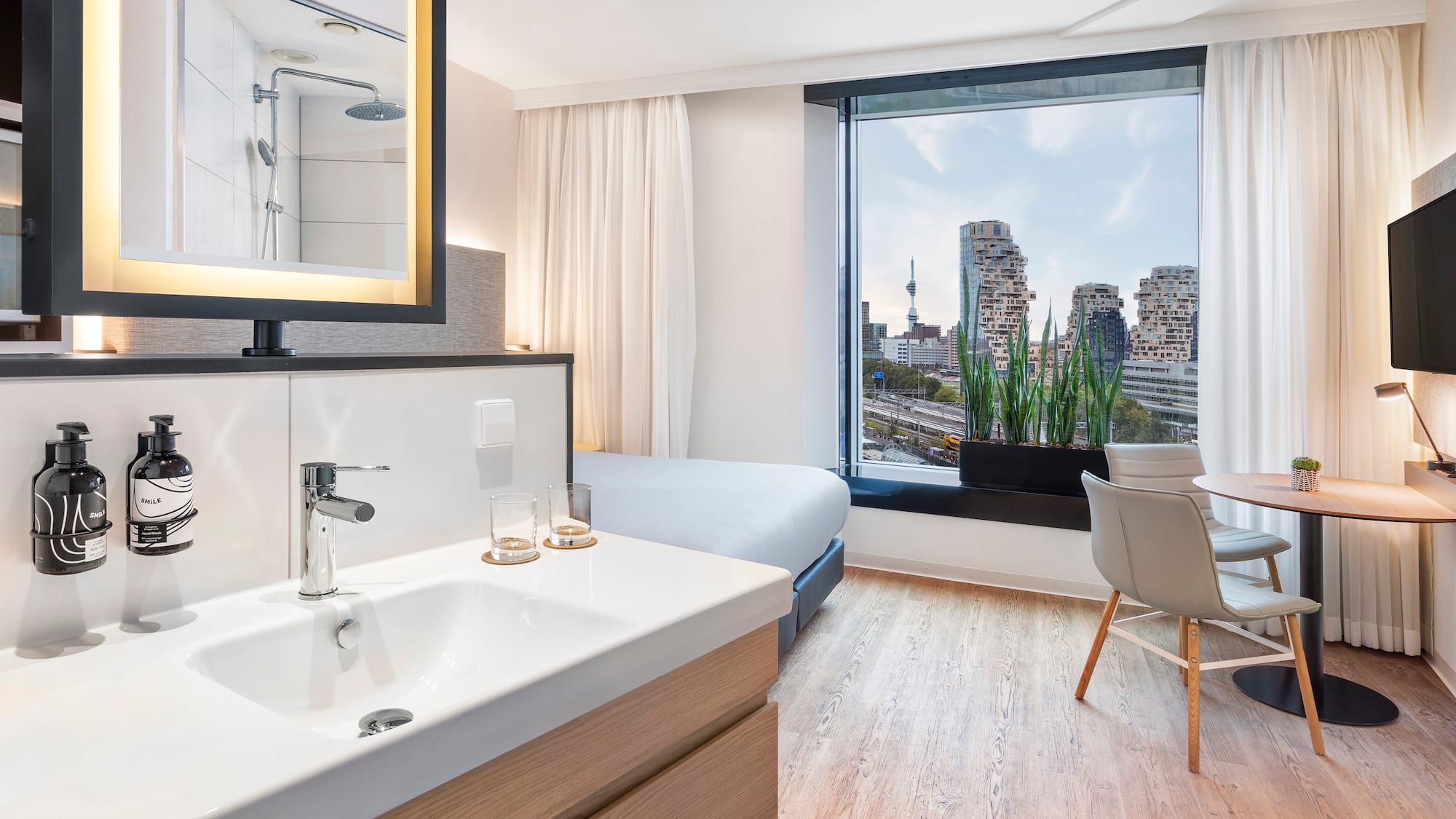 a room with a bed and a sink