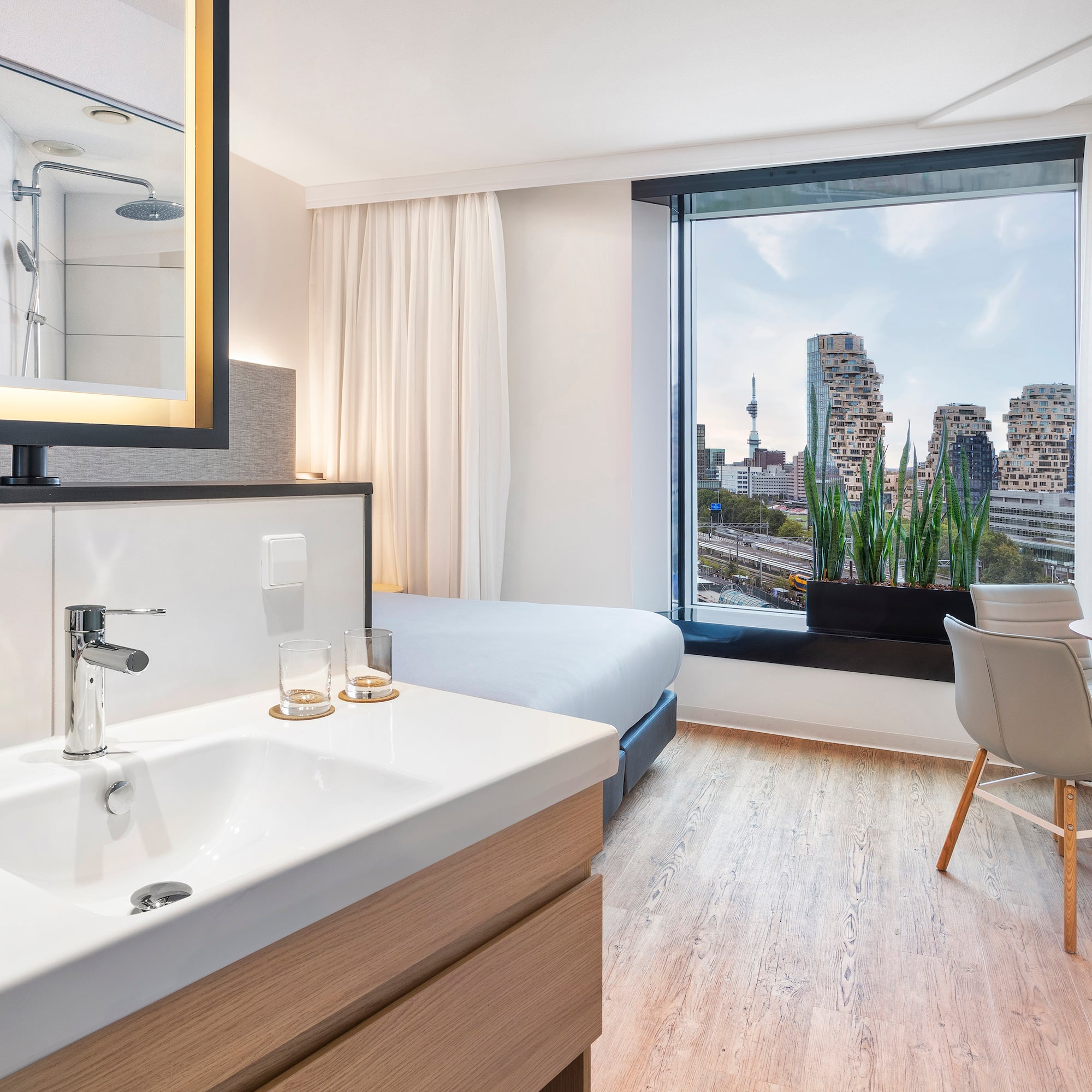 a room with a bed and a sink