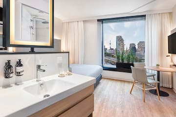 a room with a bed and a sink
