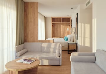 a room with couches and a bed