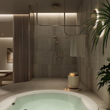 a bathroom with a large tub and shower