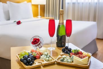 a couple of trays of food and wine on a table
