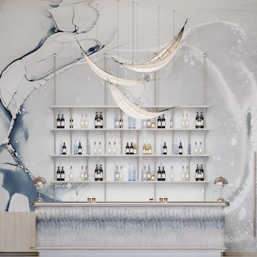 a bar with shelves of bottles and a wall of water