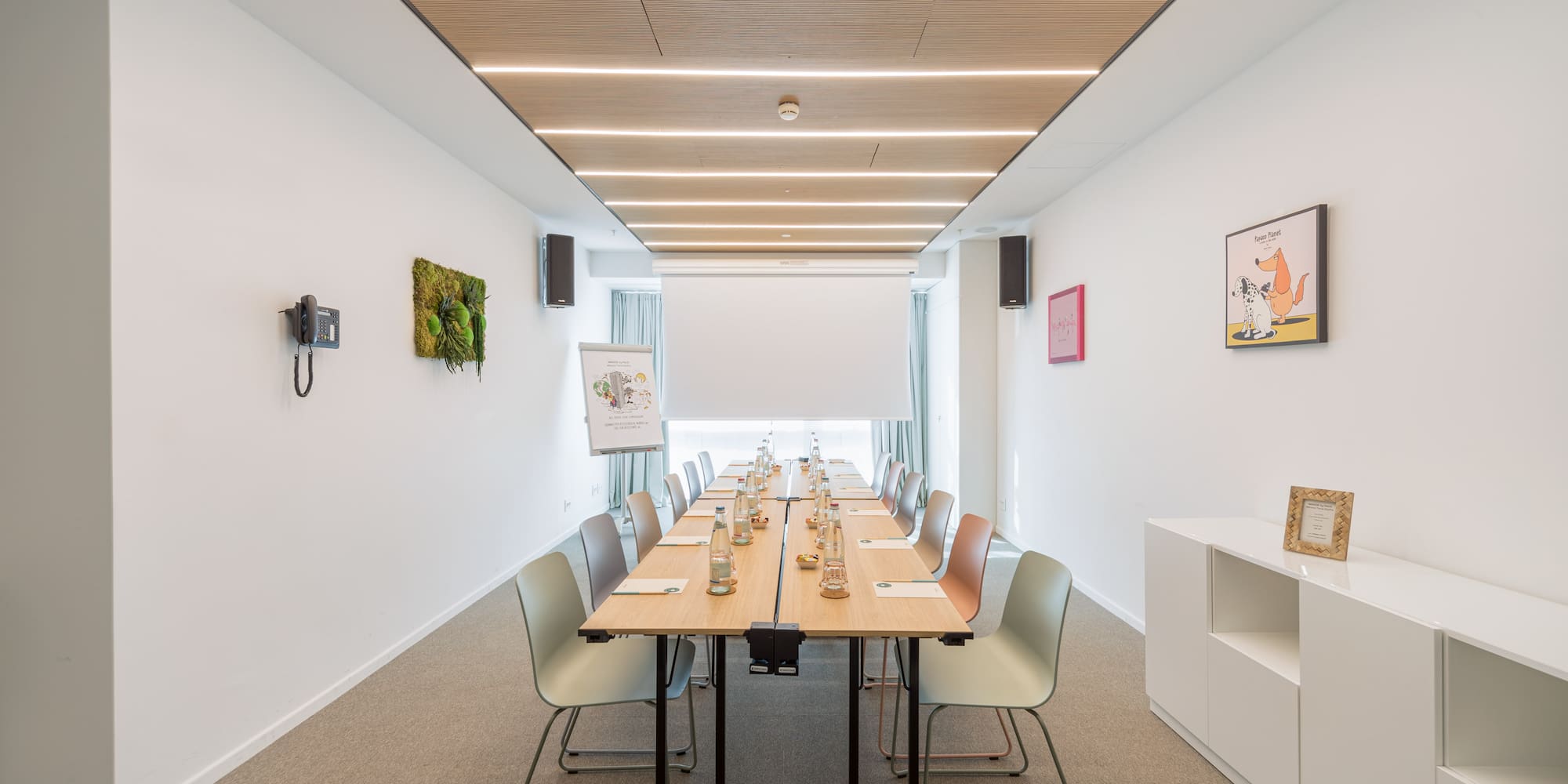 a room with a long table and chairs
