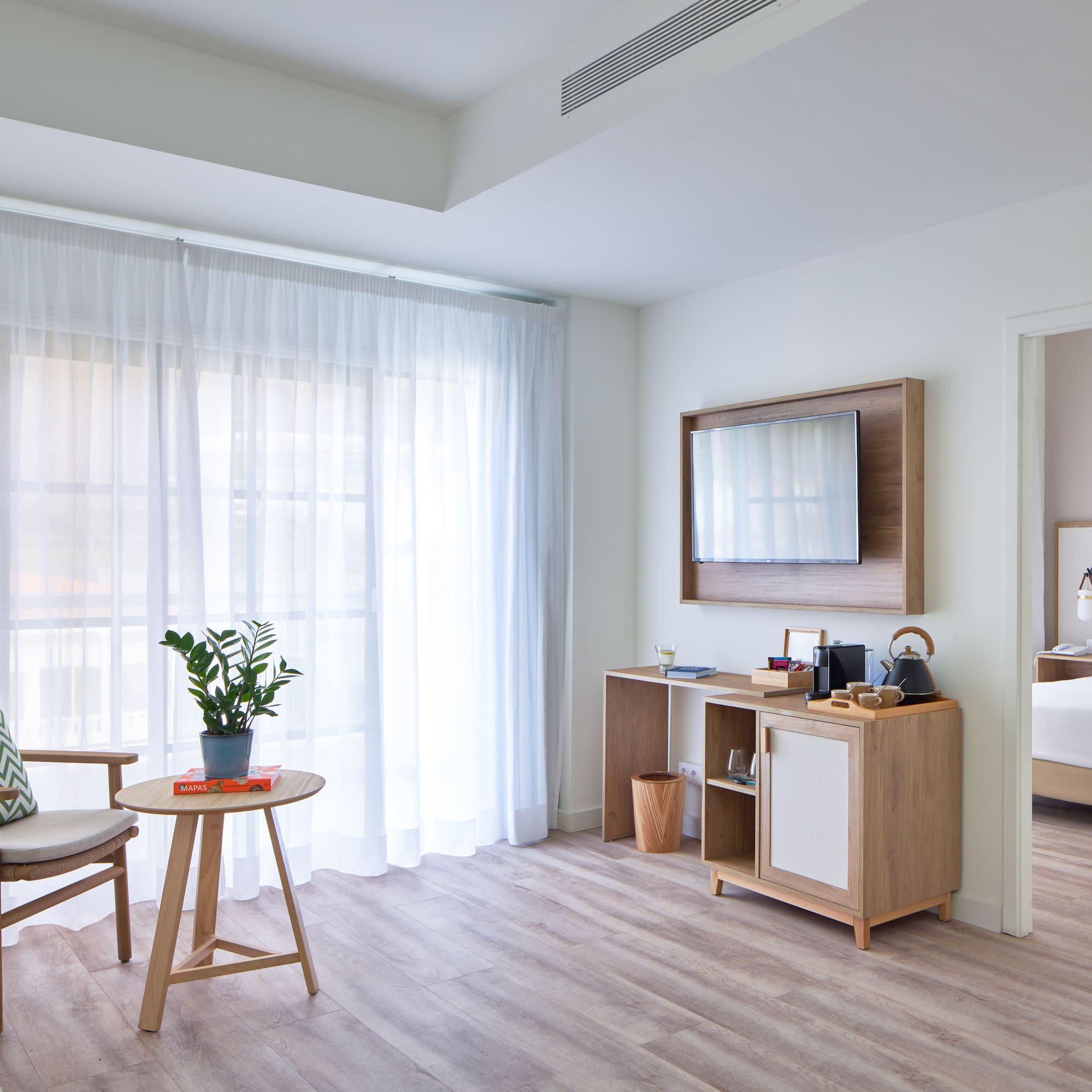 a room with a bed and a chair