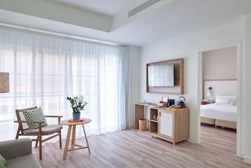 a room with a bed and a chair