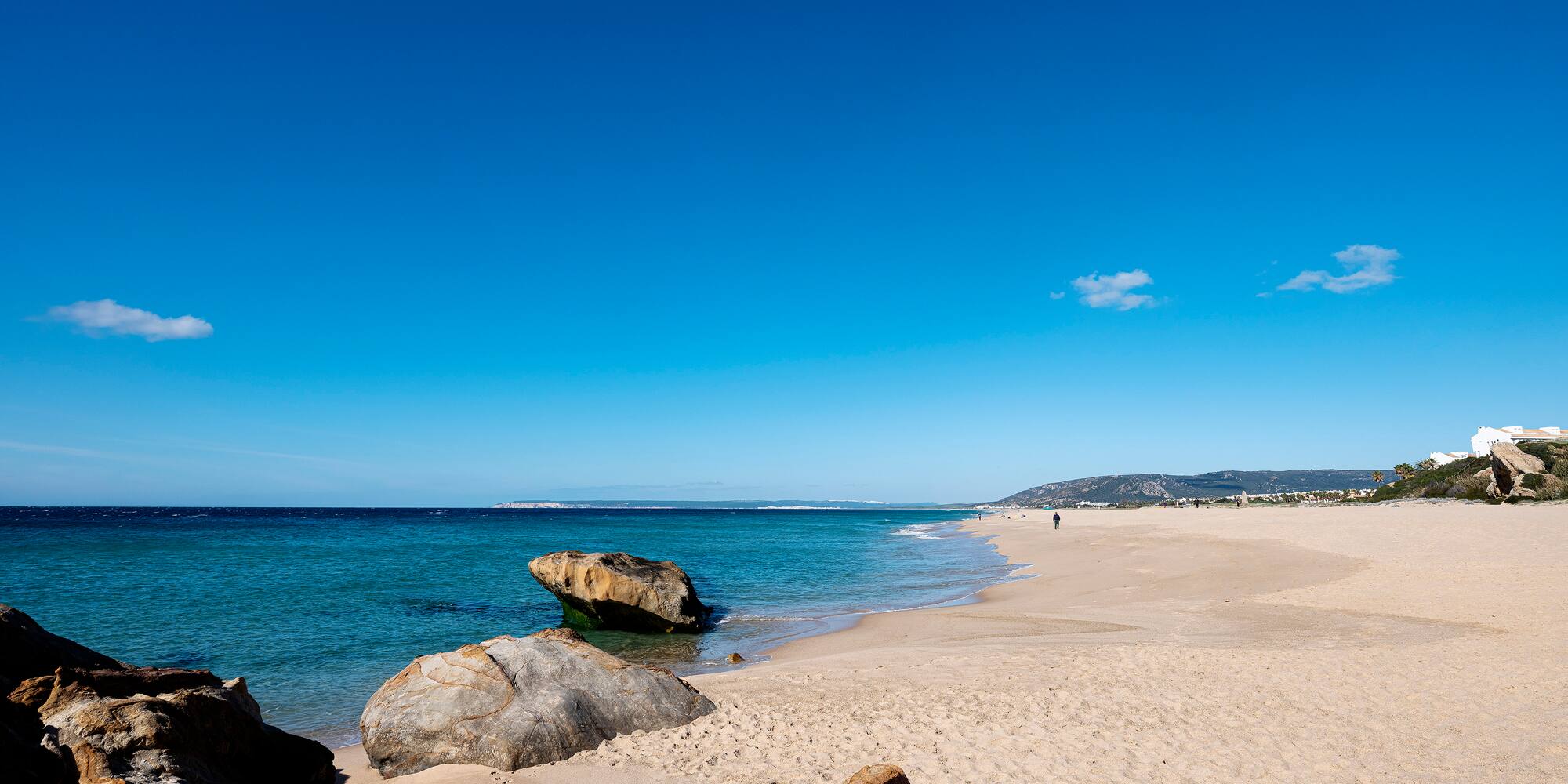 a beach with rocks and water