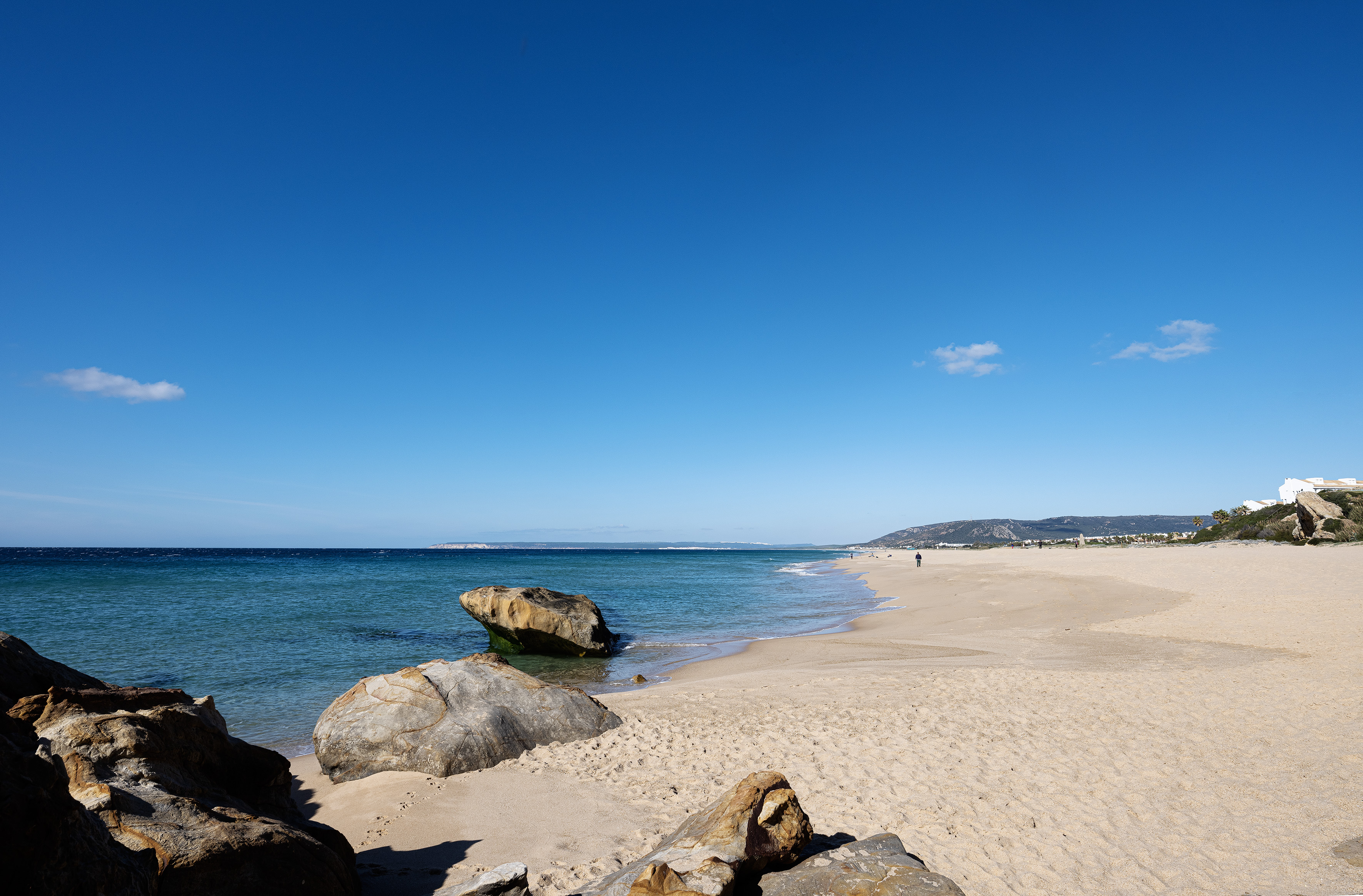a beach with rocks and water