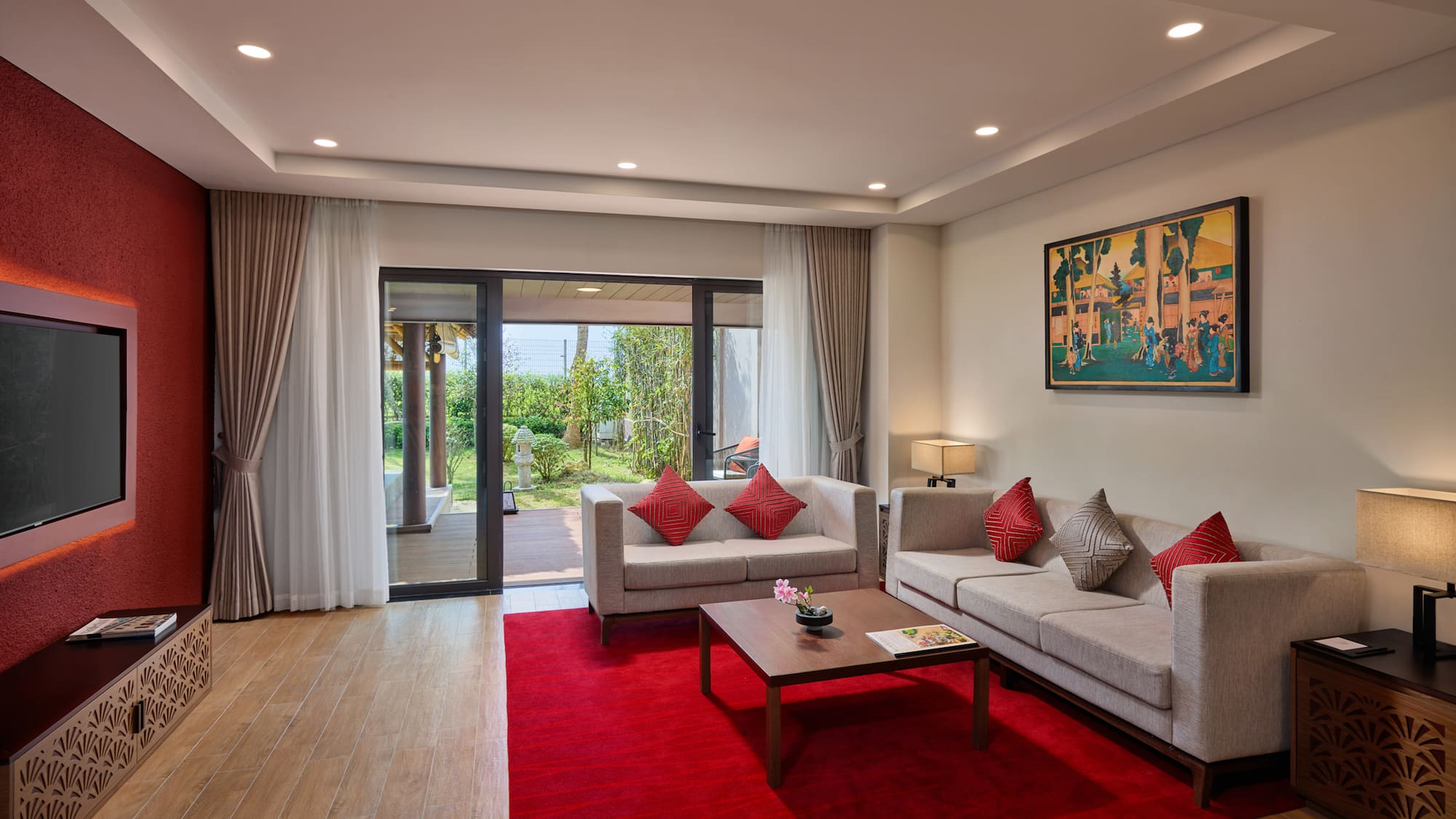 a living room with a red rug and couches