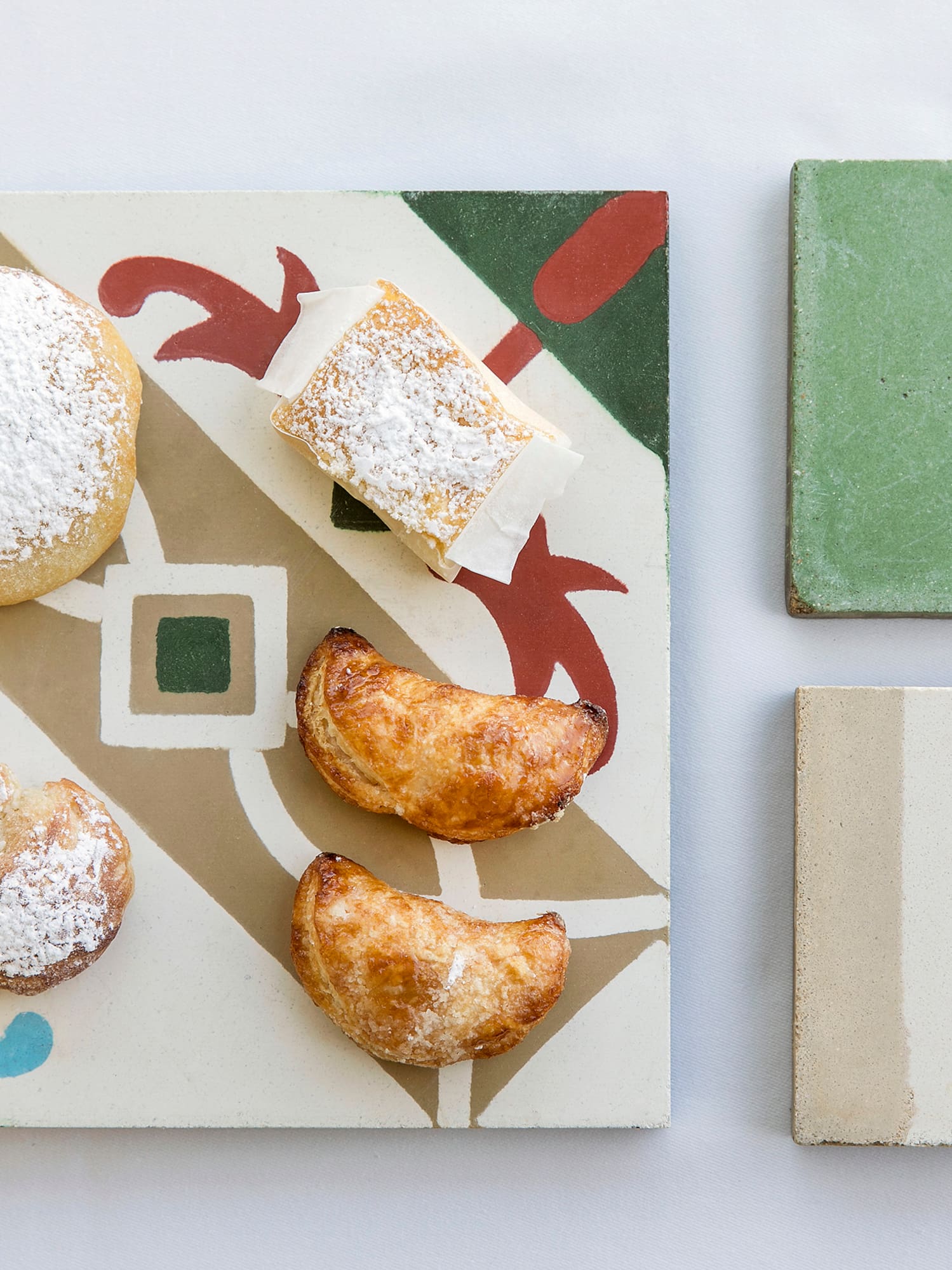 a plate of pastries and cheese