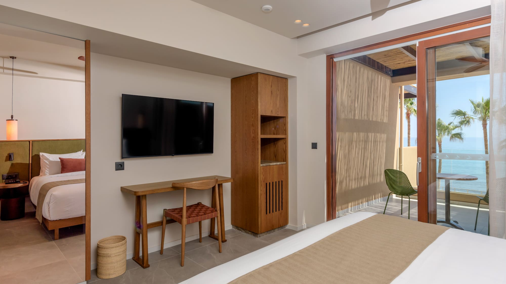 a room with a bed and a television on the wall.