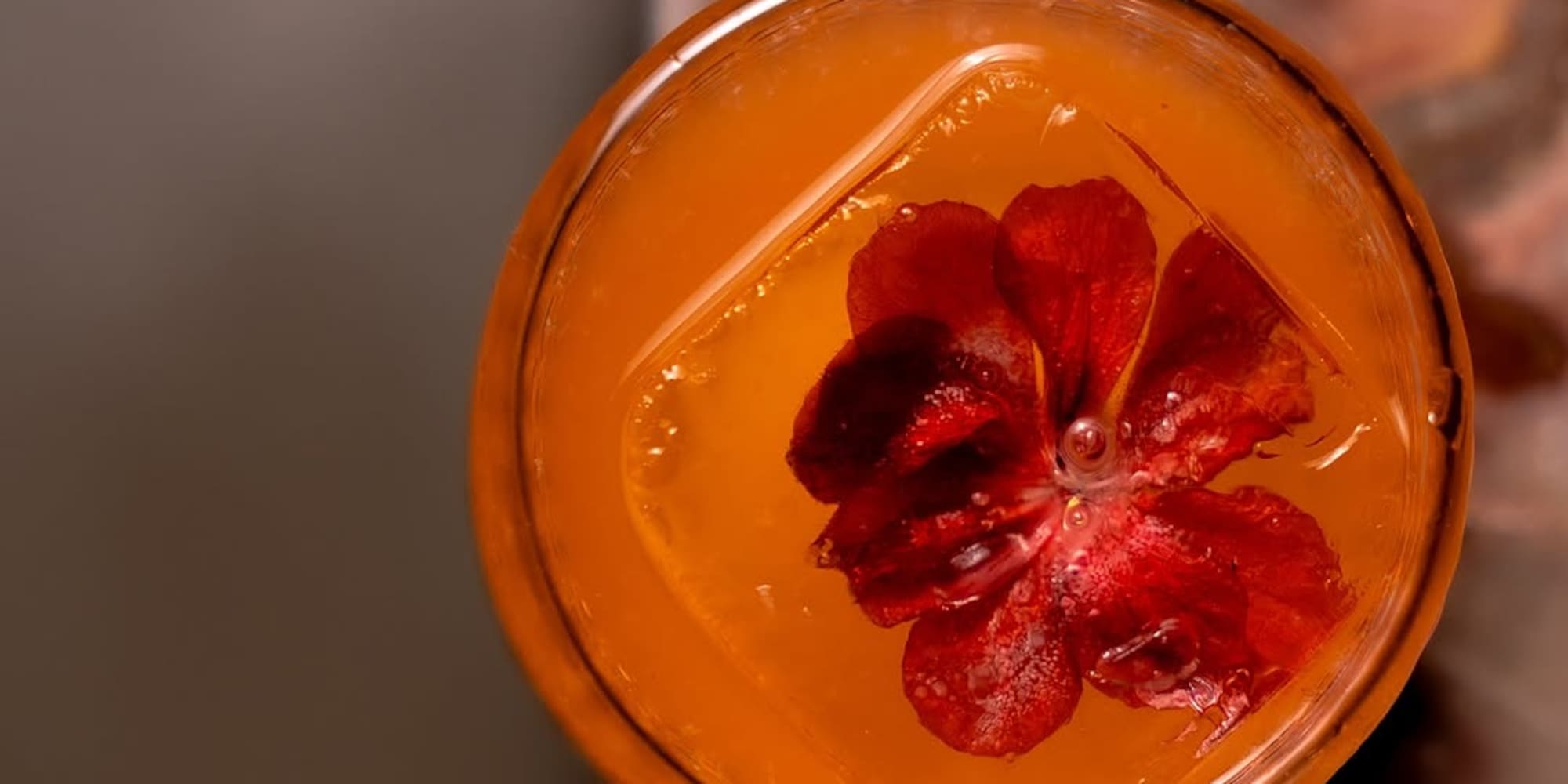 a glass with a flower in it