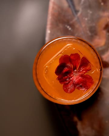 a glass with a flower in it