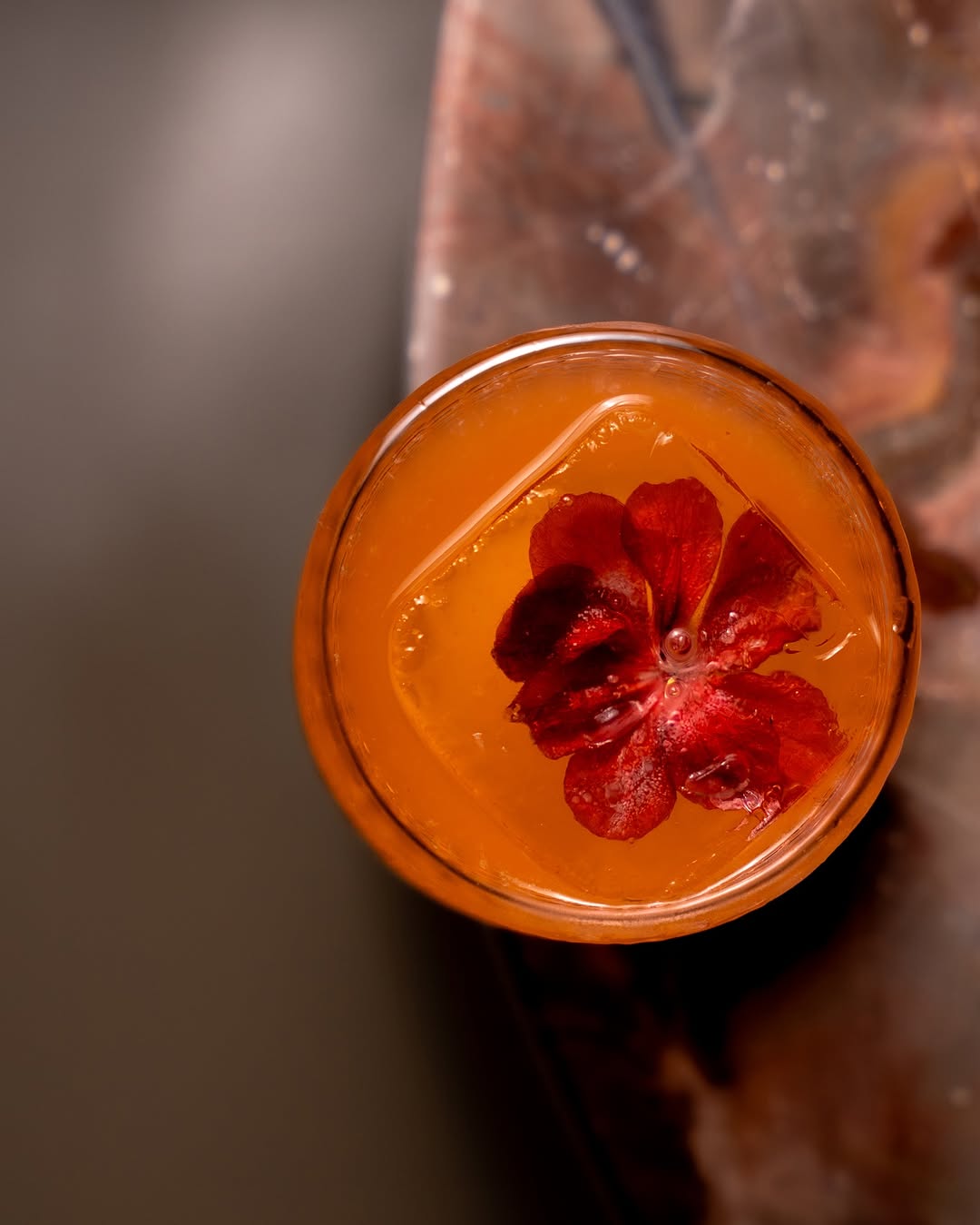 a glass with a flower in it