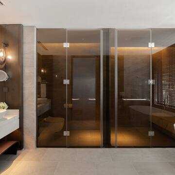 a bathroom with glass doors and a sink