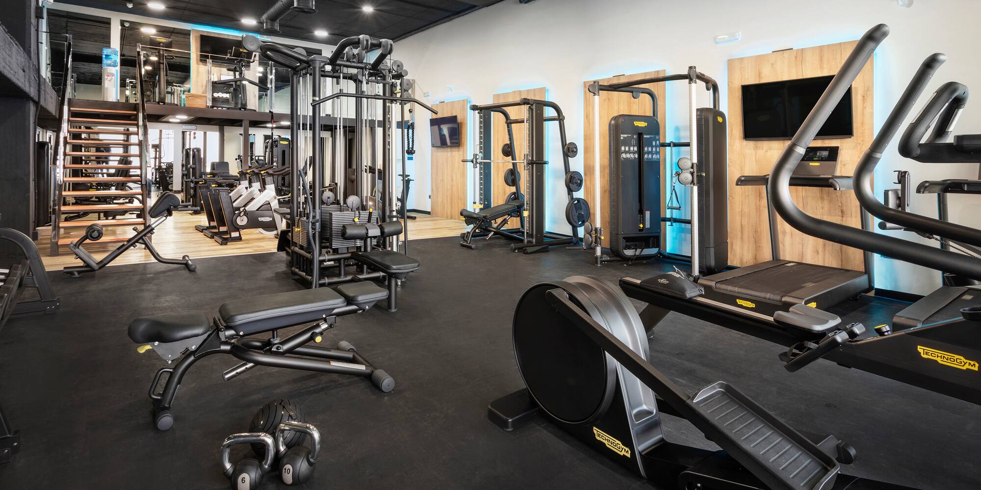 a large gym with exercise equipment