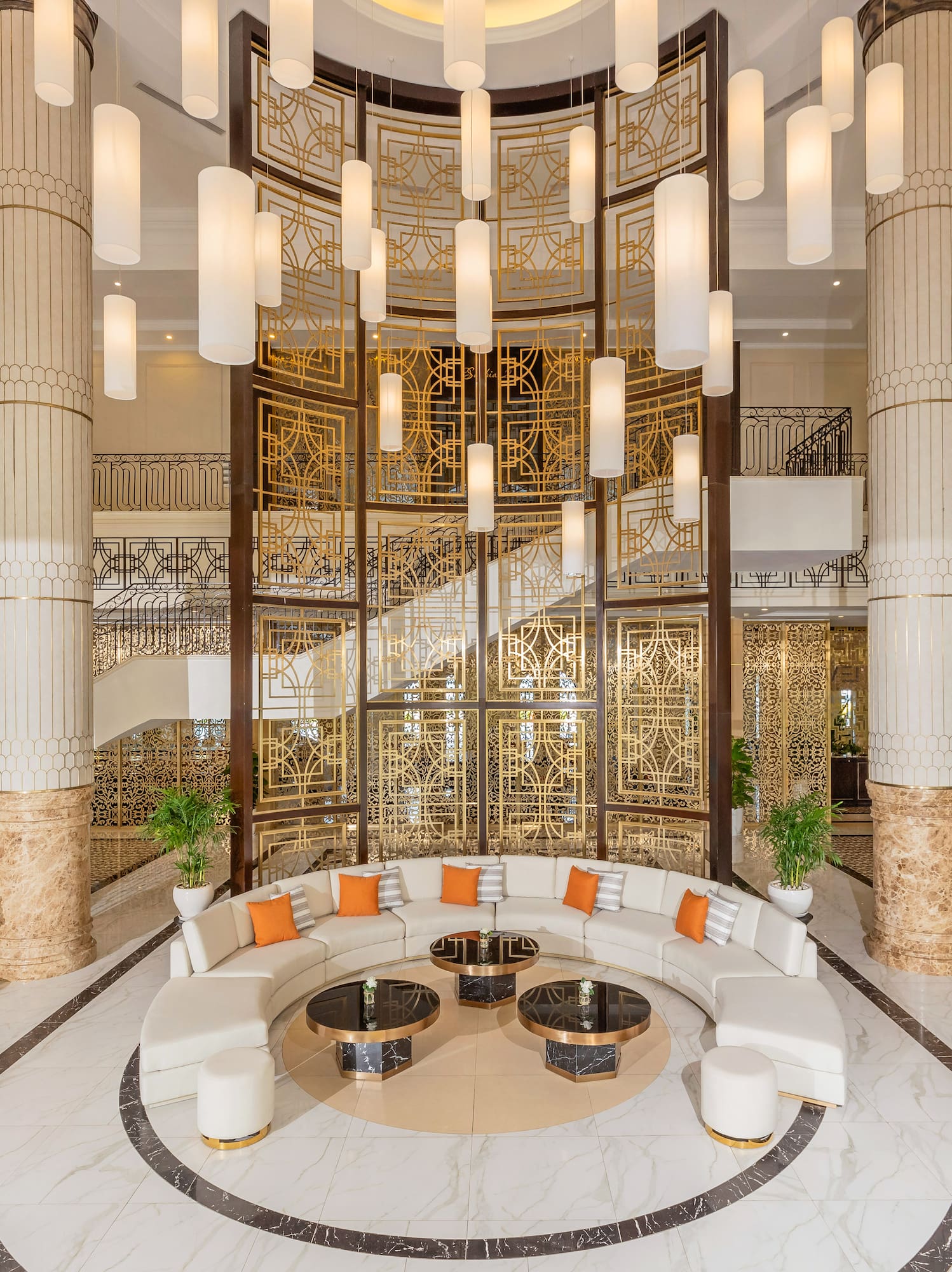 a large lobby with a round table and chairs