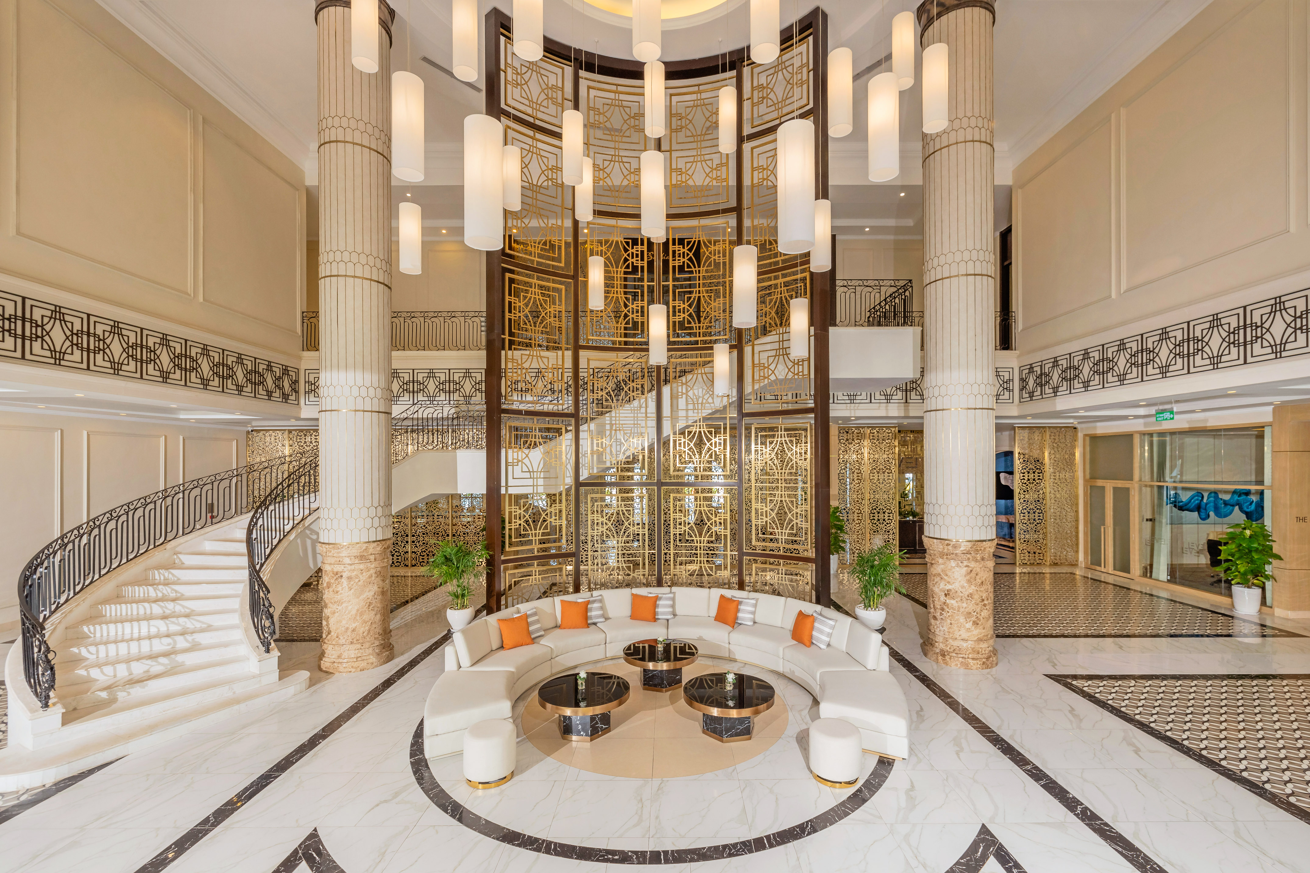 a large lobby with a round table and chairs