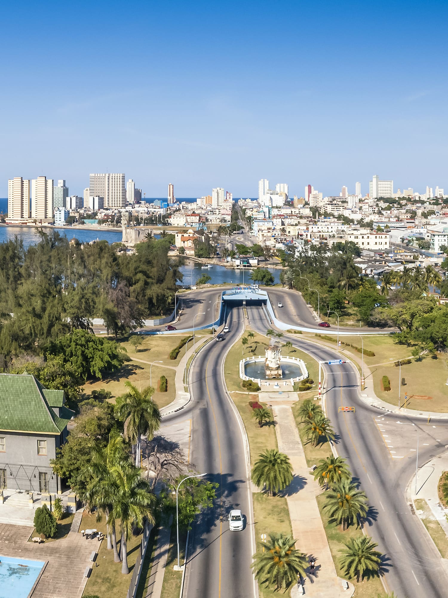 a city with a body of water and a fountain