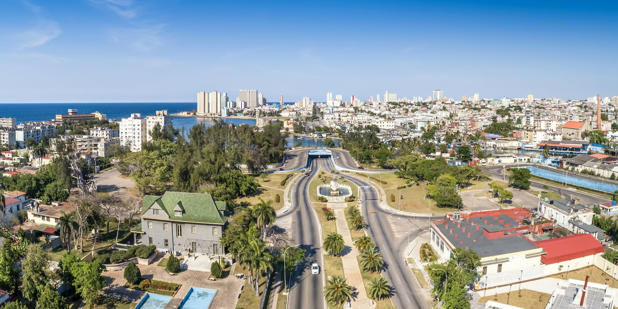 a city with a body of water and a fountain