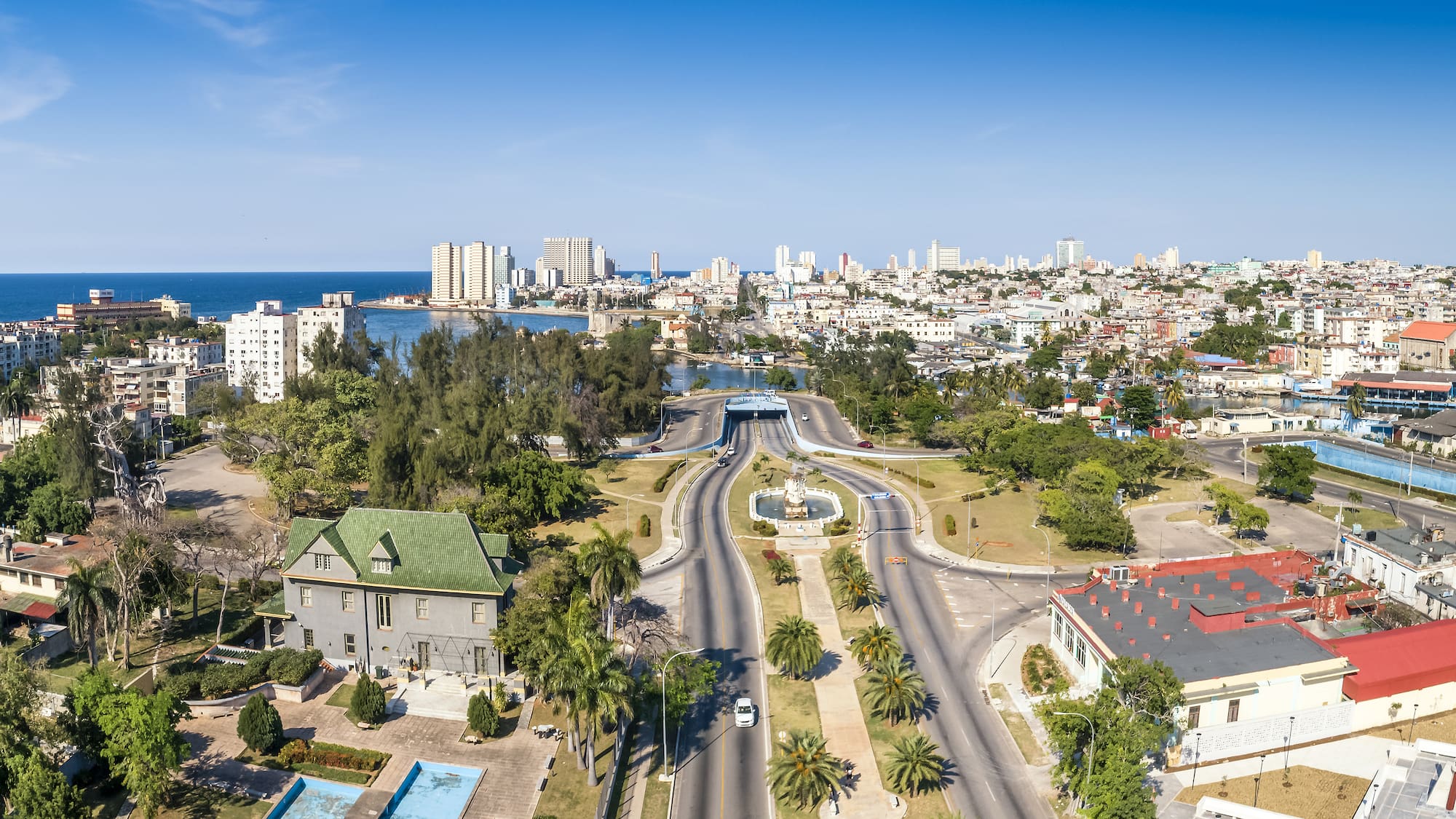 a city with a body of water and a fountain